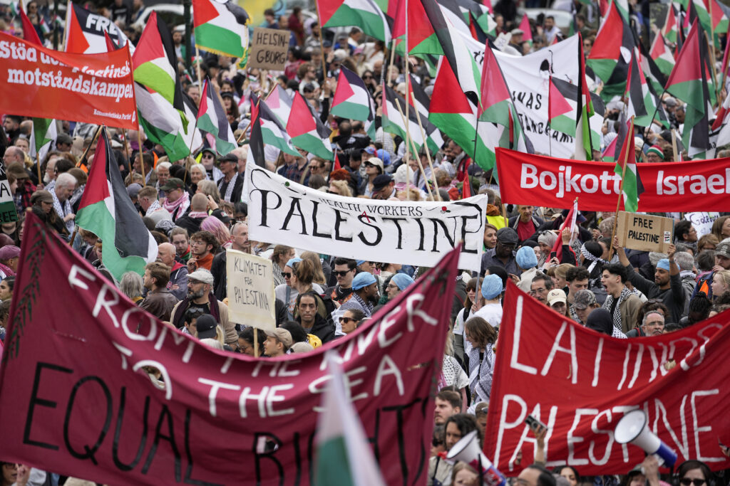 People carry banners and Palestinian flags during a Pro-Palestinian demonstration for excluding Israel from Eurovision ahead of the second semi-final at the Eurovision Song Contest in Malmo, Sweden, Thursday, May 9, 2024. (AP Photo/Martin Meissner)