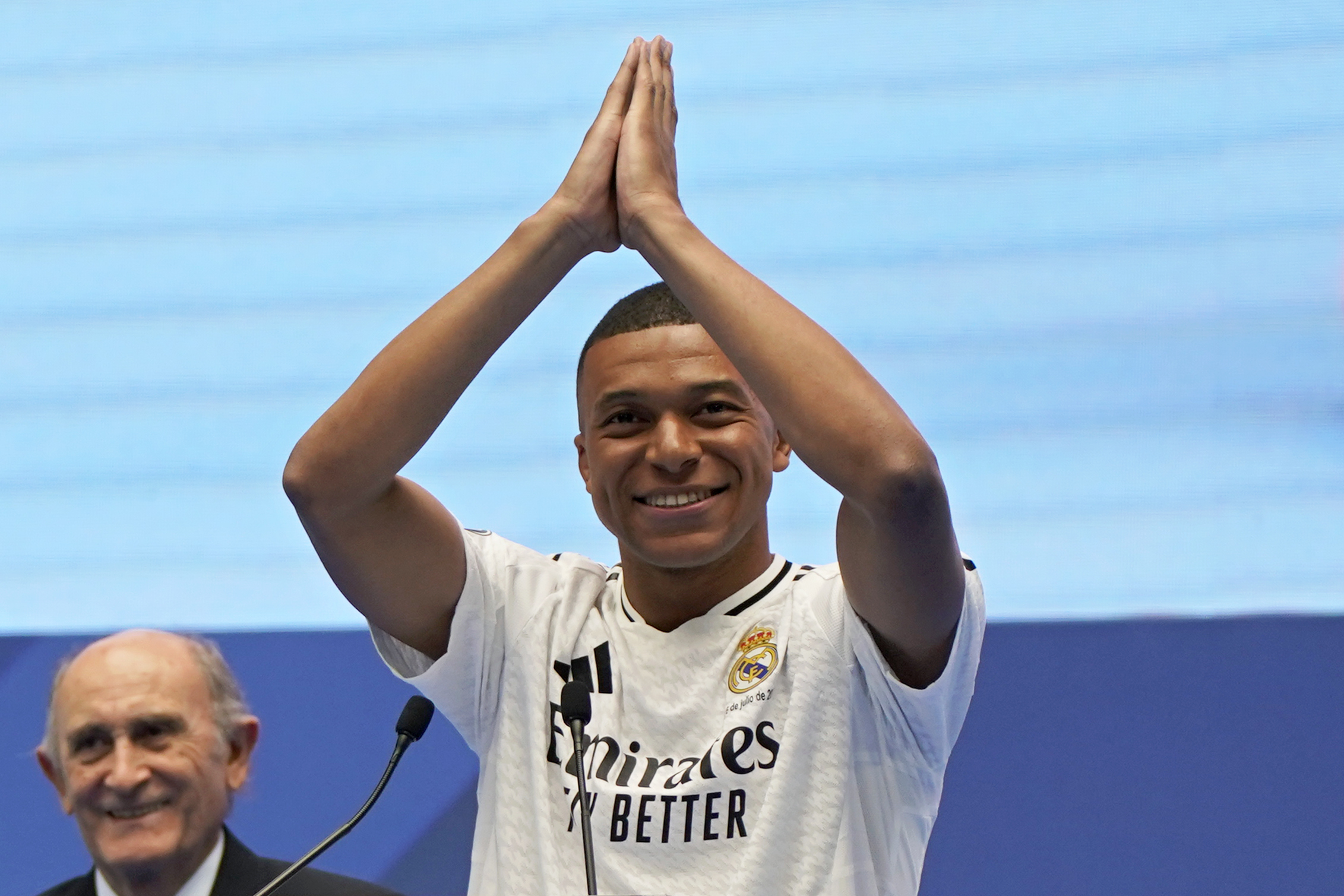 Kylian Mbappe, of France, gestures as he is presented to fans as a new Real Madrid player at the Santiago Bernabeu stadium in Madrid, Tuesday, July 16, 2024. (AP Photo/Andrea Comas)