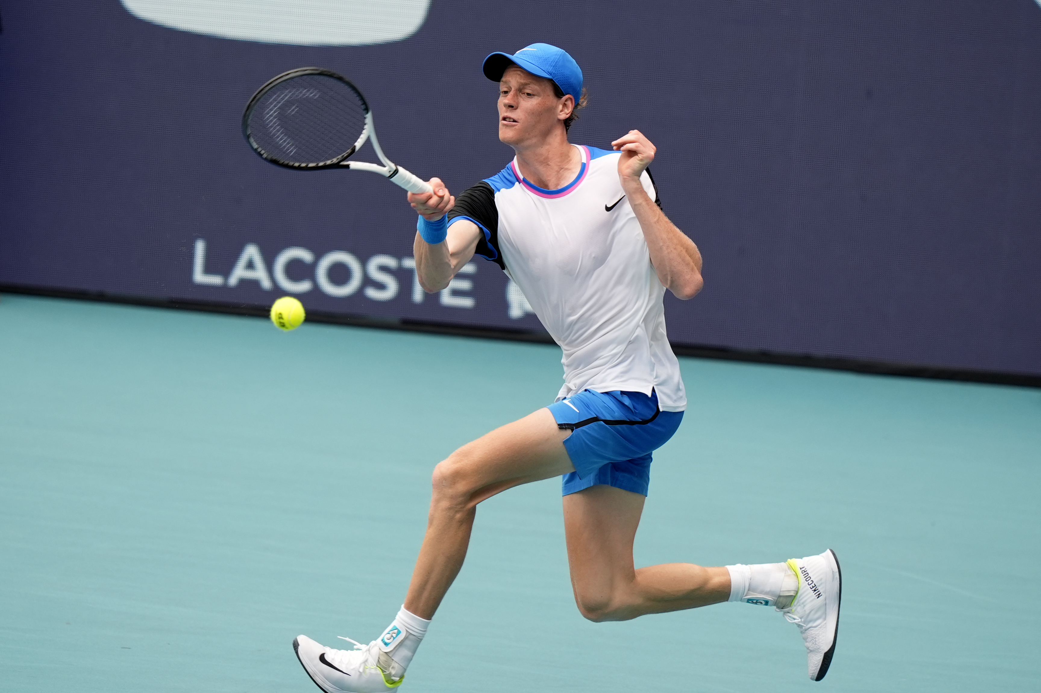 Jannik Sinner, of Italy, hits a return to Tomas Machac, of the Czech Republic, during the Miami Open tennis tournament, Wednesday, March 27, 2024, in Miami Gardens, Fla. (AP Photo/Lynne Sladky)