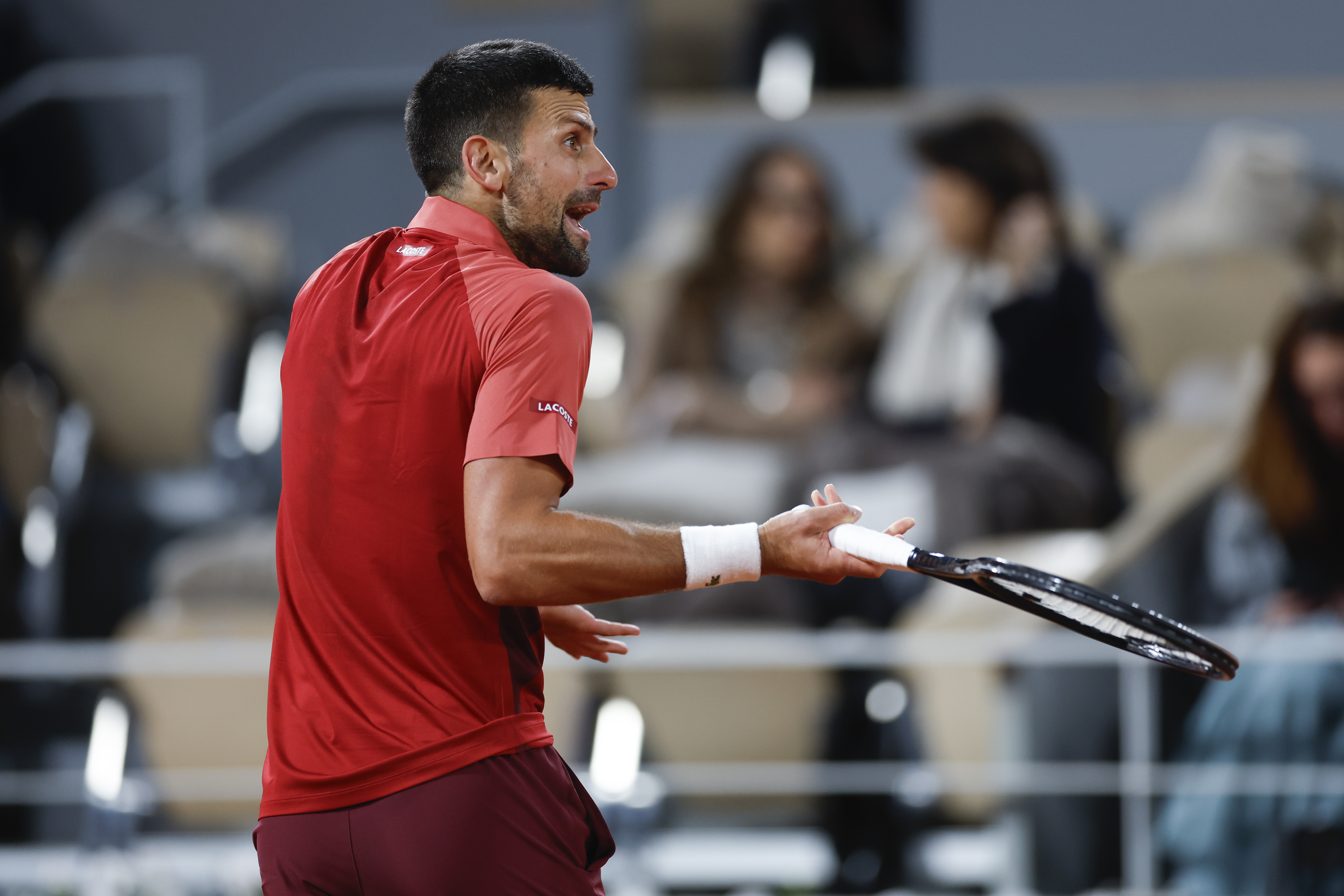 Serbia's Novak Djokovic gestures during his first round match of the French Open tennis tournament against France's Pierre-Hugues Herbert at the Roland Garros stadium in Paris, Tuesday, May 28, 2024. (AP Photo/Jean-Francois Badias)