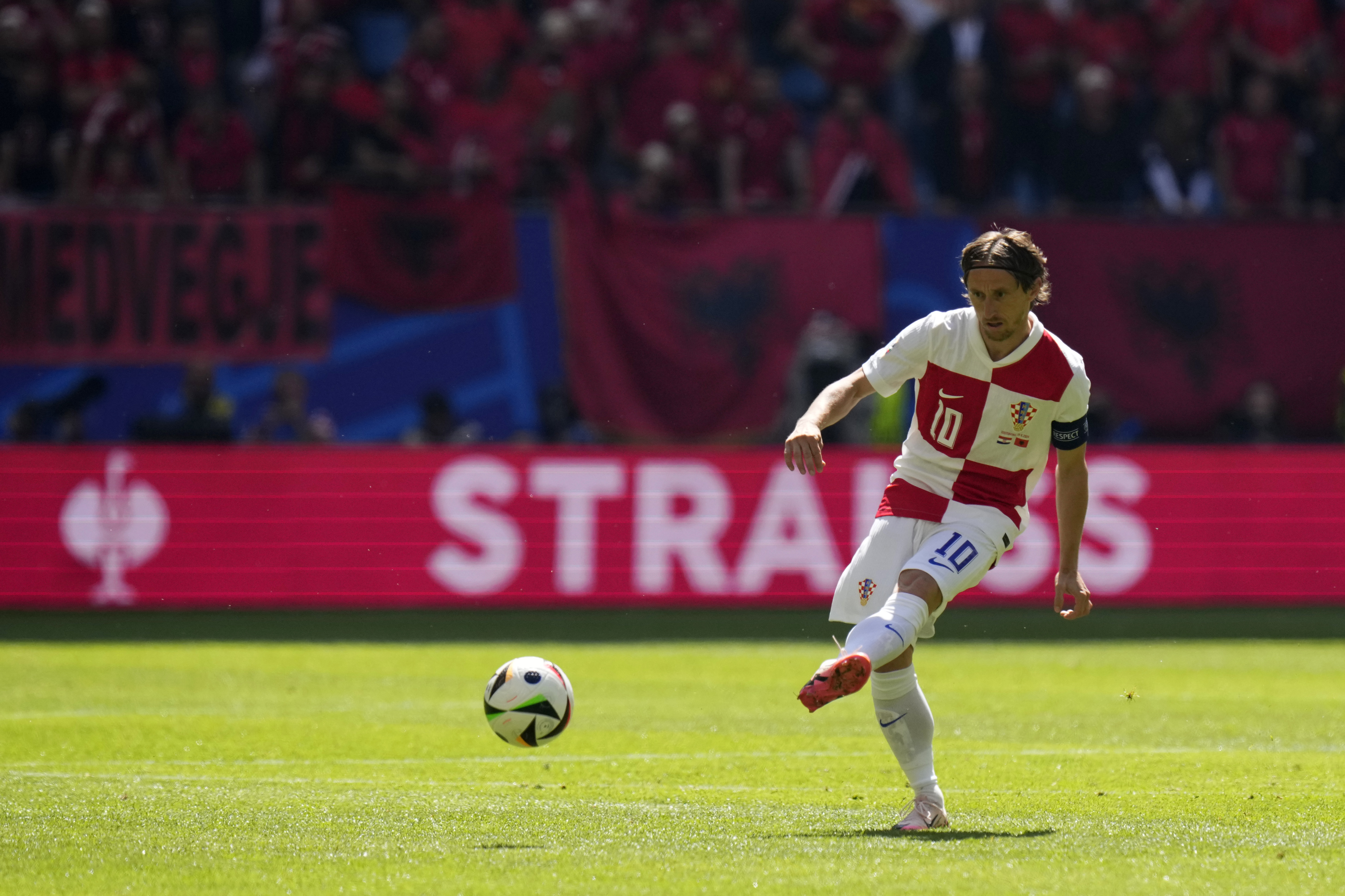 Croatia's Luka Modric passes the ball during a Group B match between Croatia and Albania at the Euro 2024 soccer tournament in Hamburg, Germany, Wednesday, June 19, 2024. (AP Photo/Petr Josek)
