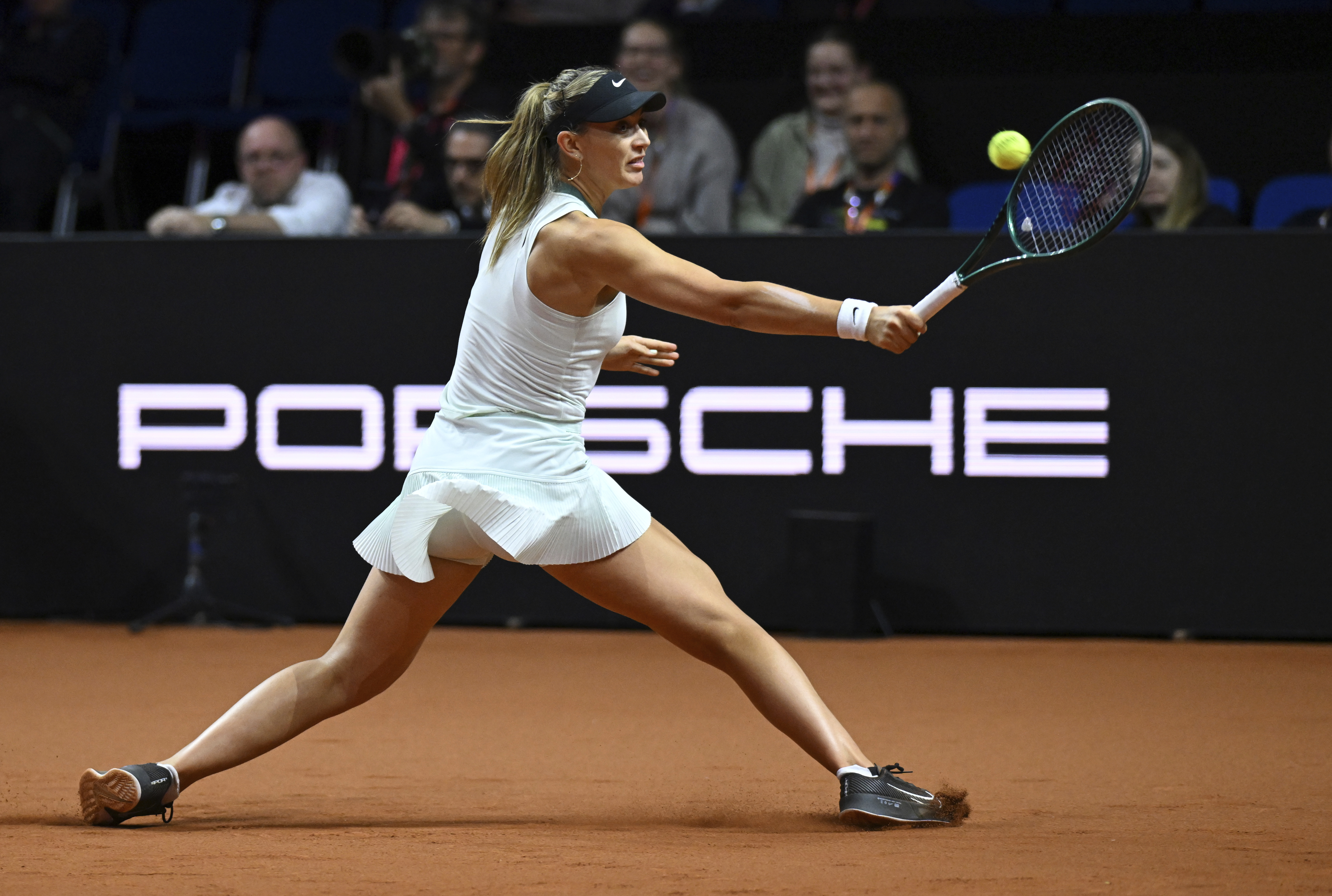 Spain's Paula Badosa hits a return to Aryna Sabalenka, of Belarus, during the first round match at the Porsche Tennis Grand Prix tournament, Wednesday, April 17, 2024, in Stuttgart, Germany. (Marijan Murat/dpa via AP)