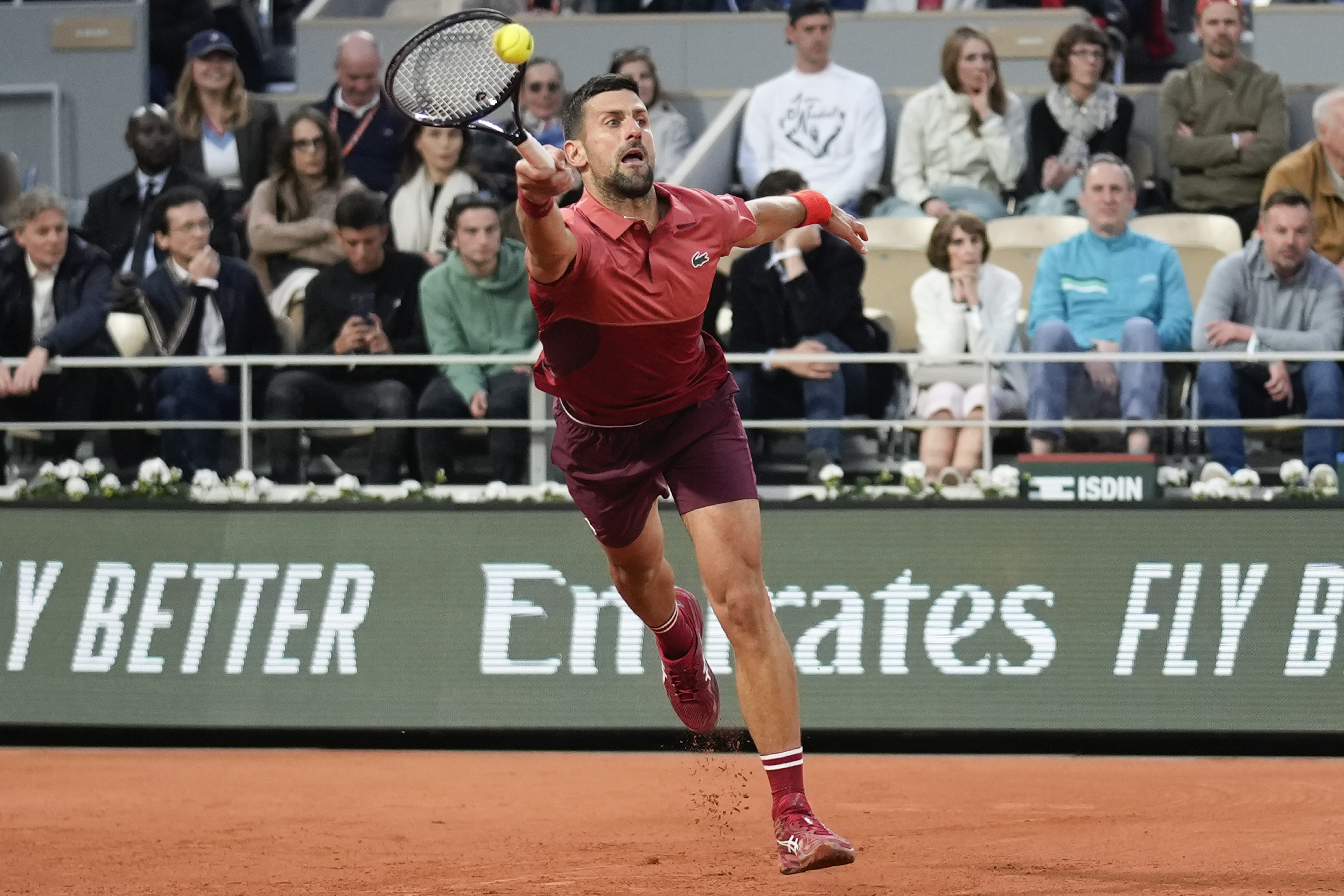 Serbia's Novak Djokovic plays a shot against France's Pierre-Hugues Herbert during their first round match of the French Open tennis tournament at the Roland Garros stadium in Paris, Tuesday, May 28, 2024. (AP Photo/Christophe Ena)