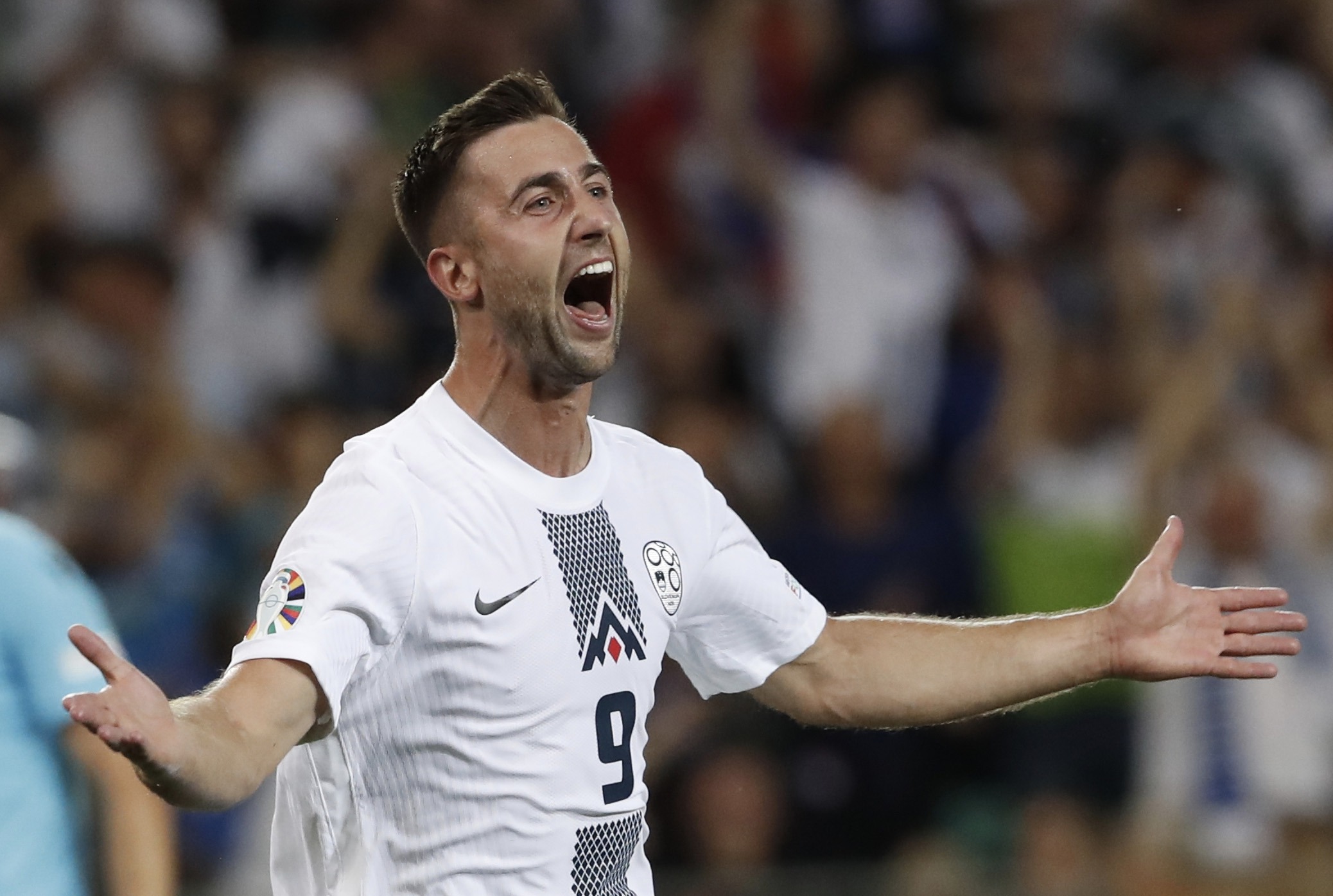 epa10700714 Andraz Sporar of Slovenia celebrates after scoring the 1-0 goal during the UEFA European Qualifiers, Group H, soccer match between Slovenia and Denmark in Ljubljana, Slovenia, 19 June 2023.  EPA-EFE/ANTONIO BAT