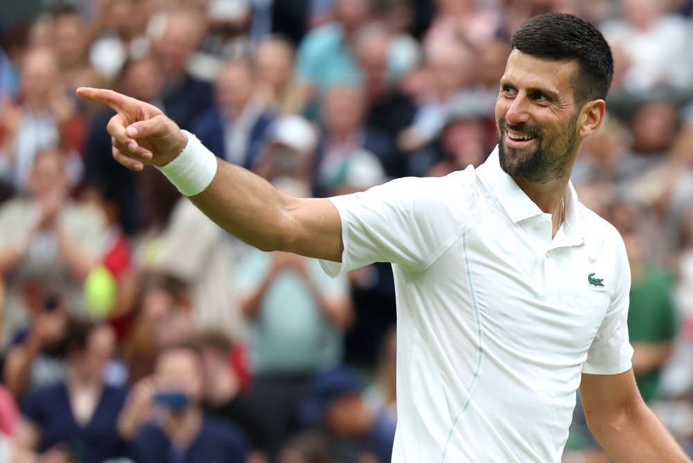 epa11452909 Novak Djokovic of Serbia celebrates winning the Men's 1st round match against Vit Kopriva of the Czech Republic at the Wimbledon Championships, Wimbledon, Britain, 02 July 2024.  EPA-EFE/NEIL HALL  EDITORIAL USE ONLY
