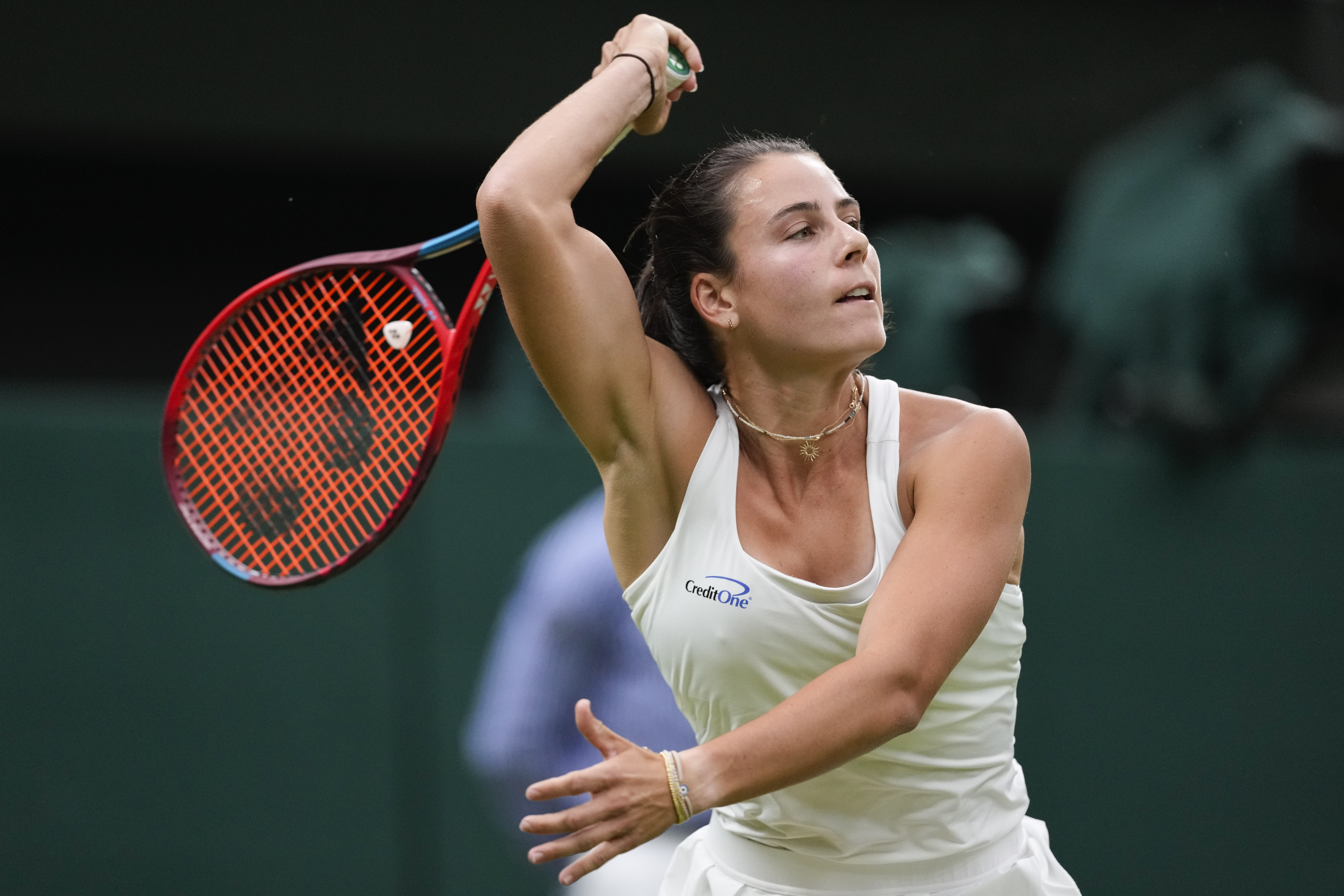 Emma Navarro of the United States plays a forehand return to Naomi Osaka of Japan during their match on day three at the Wimbledon tennis championships in London, Wednesday, July 3, 2024. (AP Photo/Alberto Pezzali)