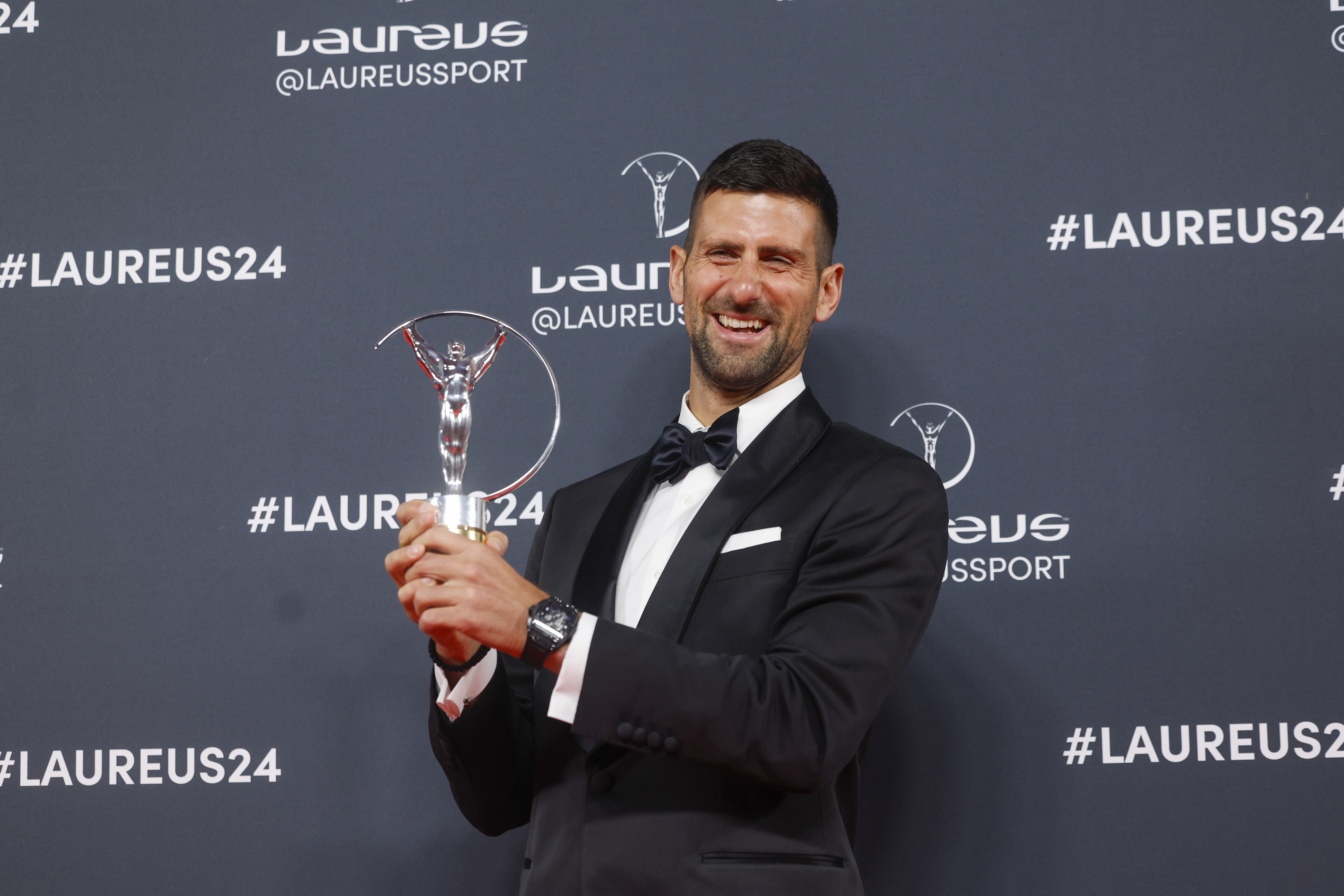 epa11294751 Serbian tennis player Novak Djokovic poses for photographers after receiving the '2024 Laureus World Sportsman of the Year' award during the 2024 Laureus World Sports Awards ceremony, in Madrid, Spain, 22 April 2024.  EPA-EFE/JUANJO MARTIN