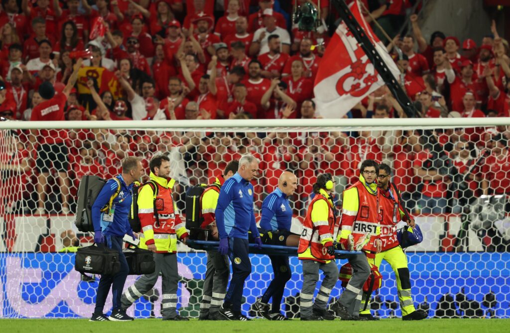 epa11424086 Kieran Tierney of Scotland is stretchered off the pitch during the UEFA EURO 2024 group A soccer match between Scotland and Switzerland, in Cologne, Germany, 19 June 2024.  EPA-EFE/FRIEDEMANN VOGEL