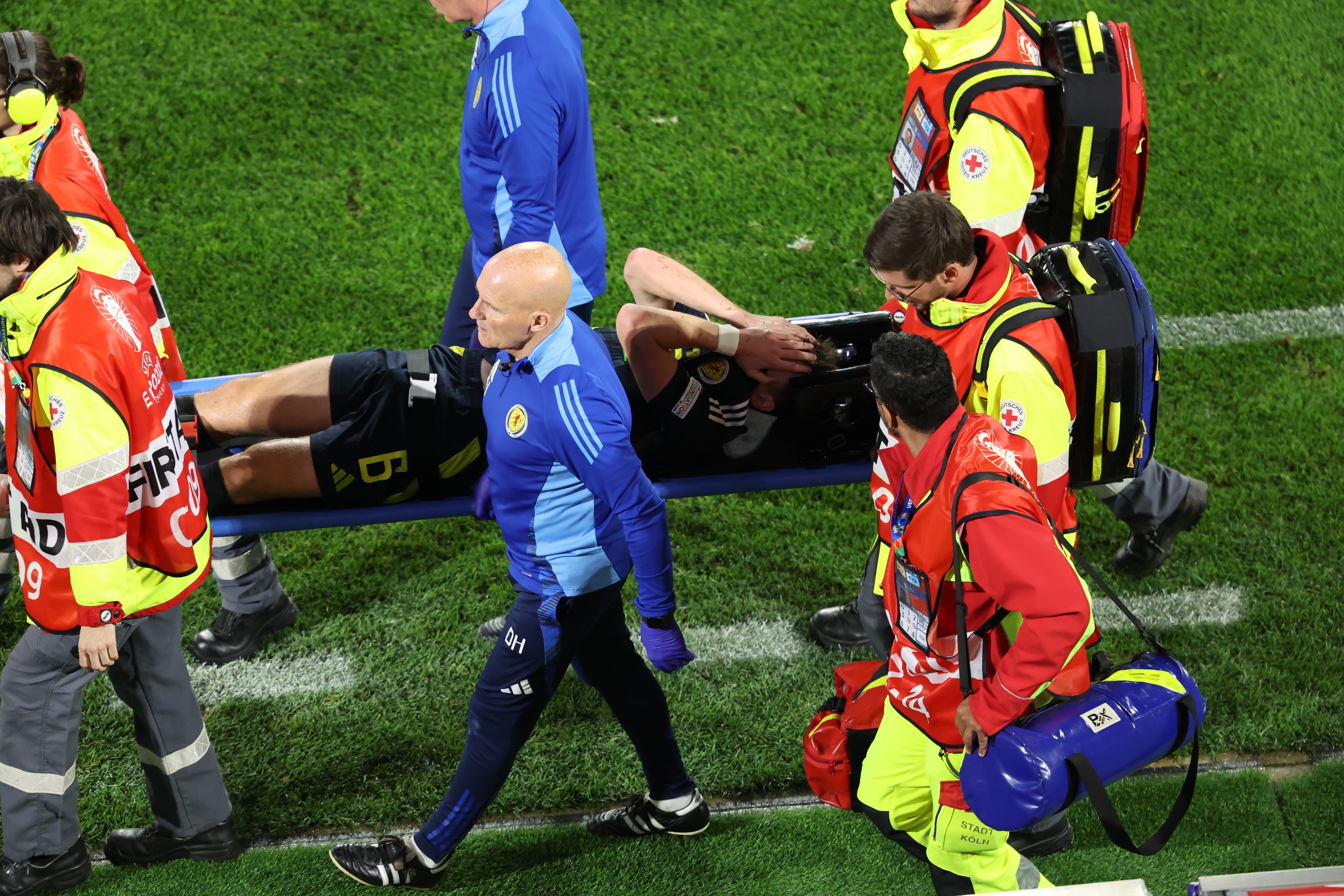 epa11424079 Kieran Tierney of Scotland is stretchered off the pitch during the UEFA EURO 2024 group A soccer match between Scotland and Switzerland, in Cologne, Germany, 19 June 2024.  EPA-EFE/CHRISTOPHER NEUNDORF