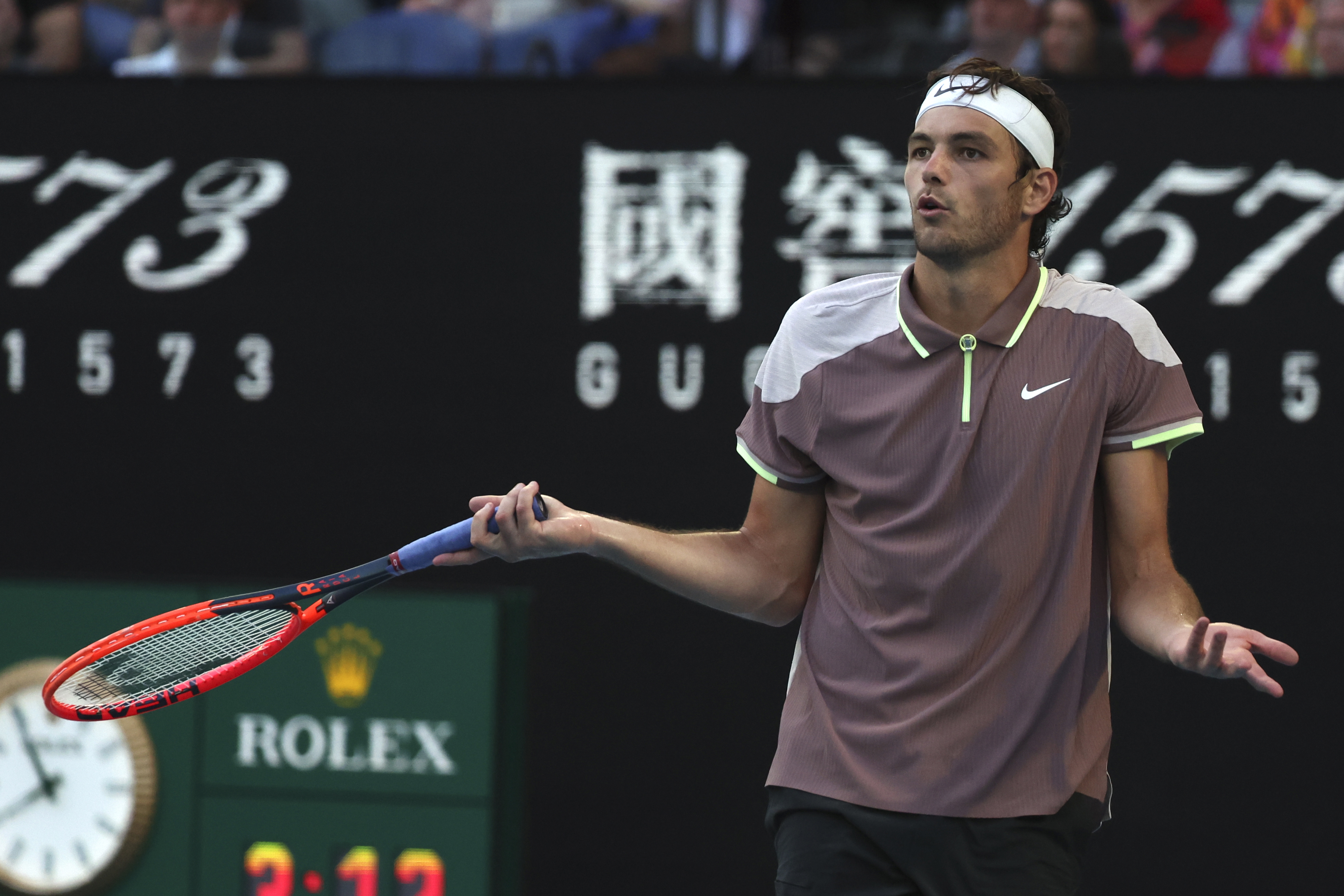 Taylor Fritz of the U.S. reacts during his quarterfinal against Novak Djokovic of Serbia at the Australian Open tennis championships at Melbourne Park, Melbourne, Australia, Tuesday, Jan. 23, 2024. (AP Photo/Asanka Brendon Ratnayake)