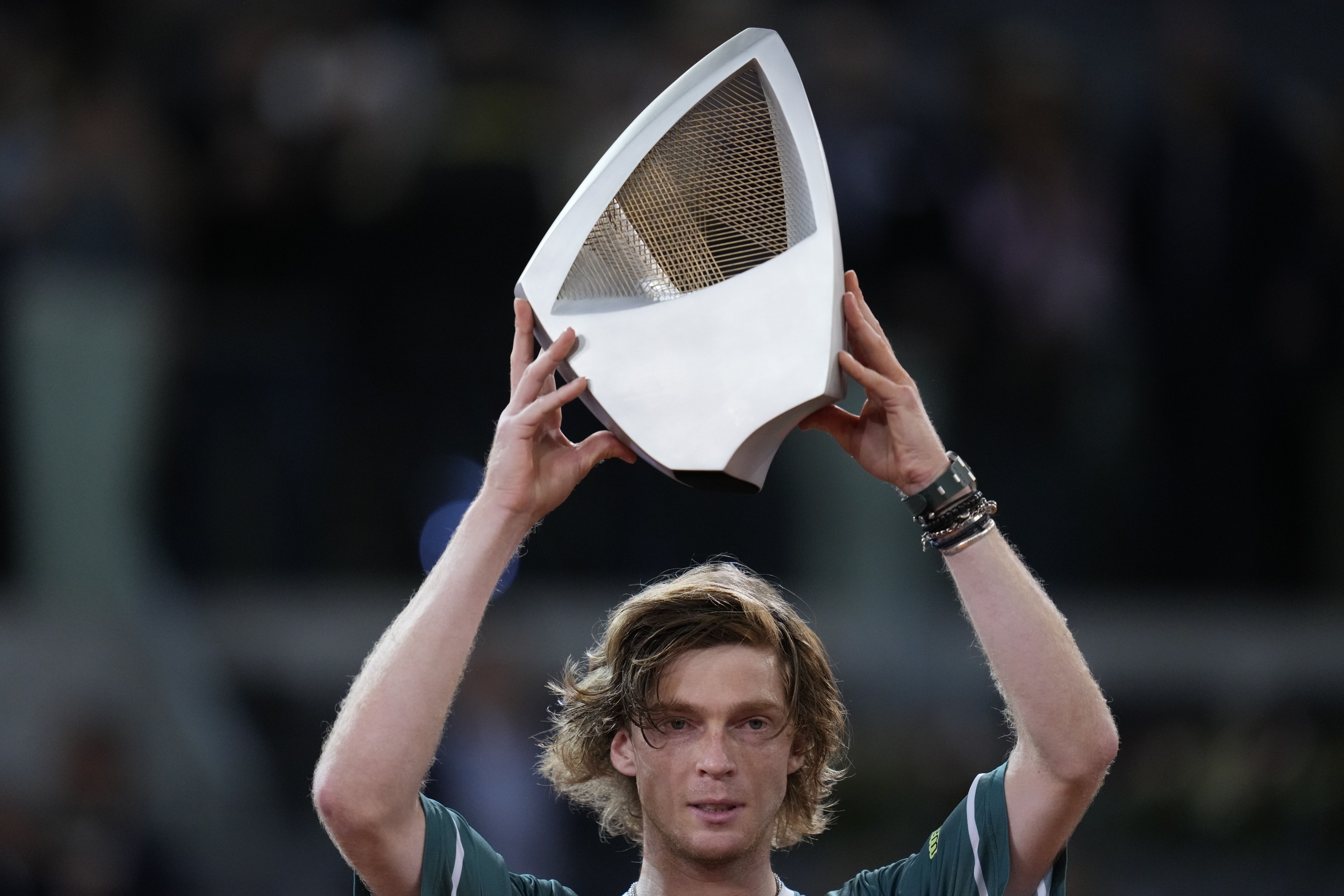 Andrey Rublev, of Russia holds his trophy after winning against Felix Auger-Aliassime, of Canada, in the Madrid Open men's final match in Madrid, Spain, Sunday, May 5, 2024. (AP Photo/Manu Fernandez)