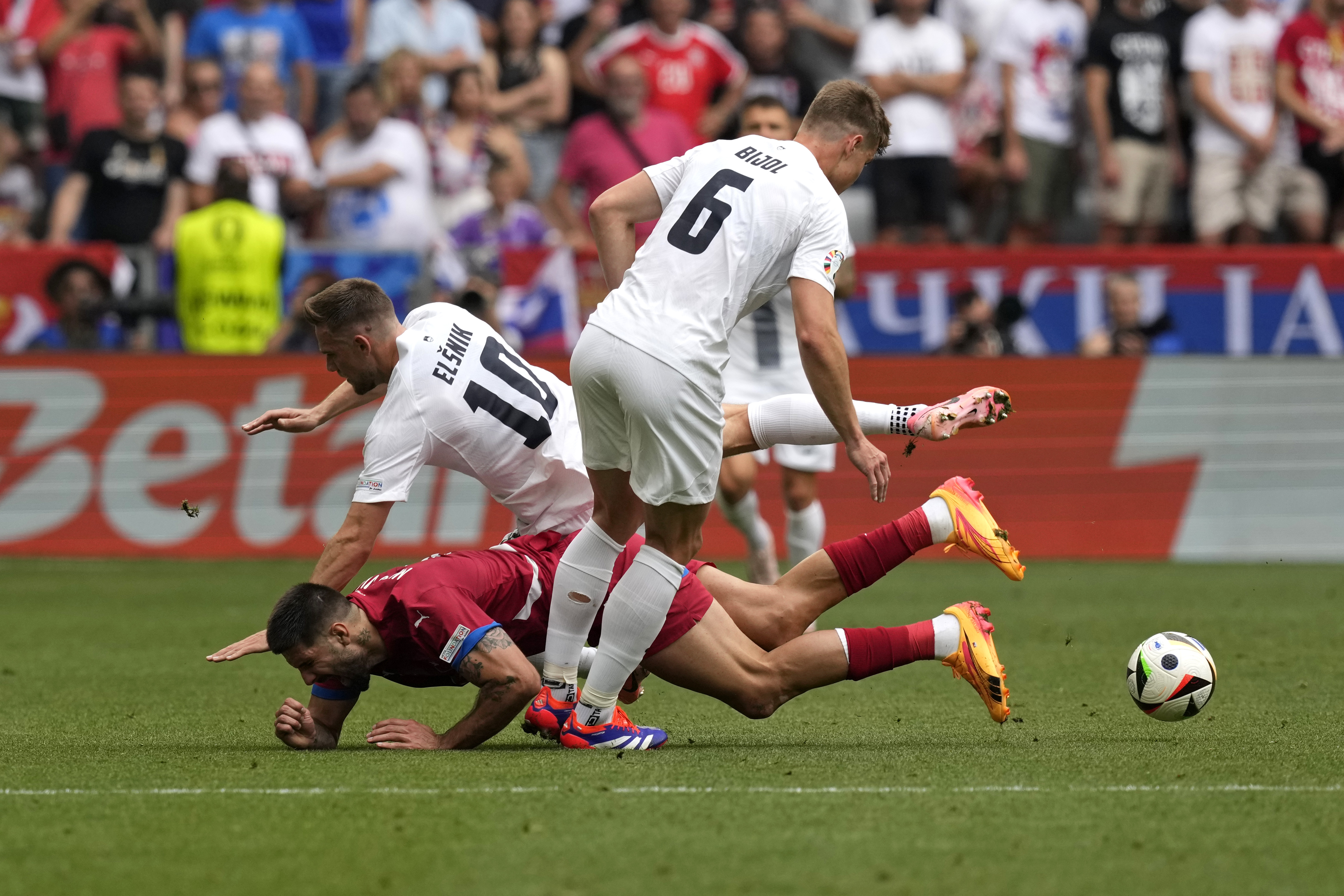 Serbia's Aleksandar Mitrovic falls during a Group C match between Slovenia and Serbia at the Euro 2024 soccer tournament in Munich, Germany, Thursday, June 20, 2024. (AP Photo/Antonio Calanni)