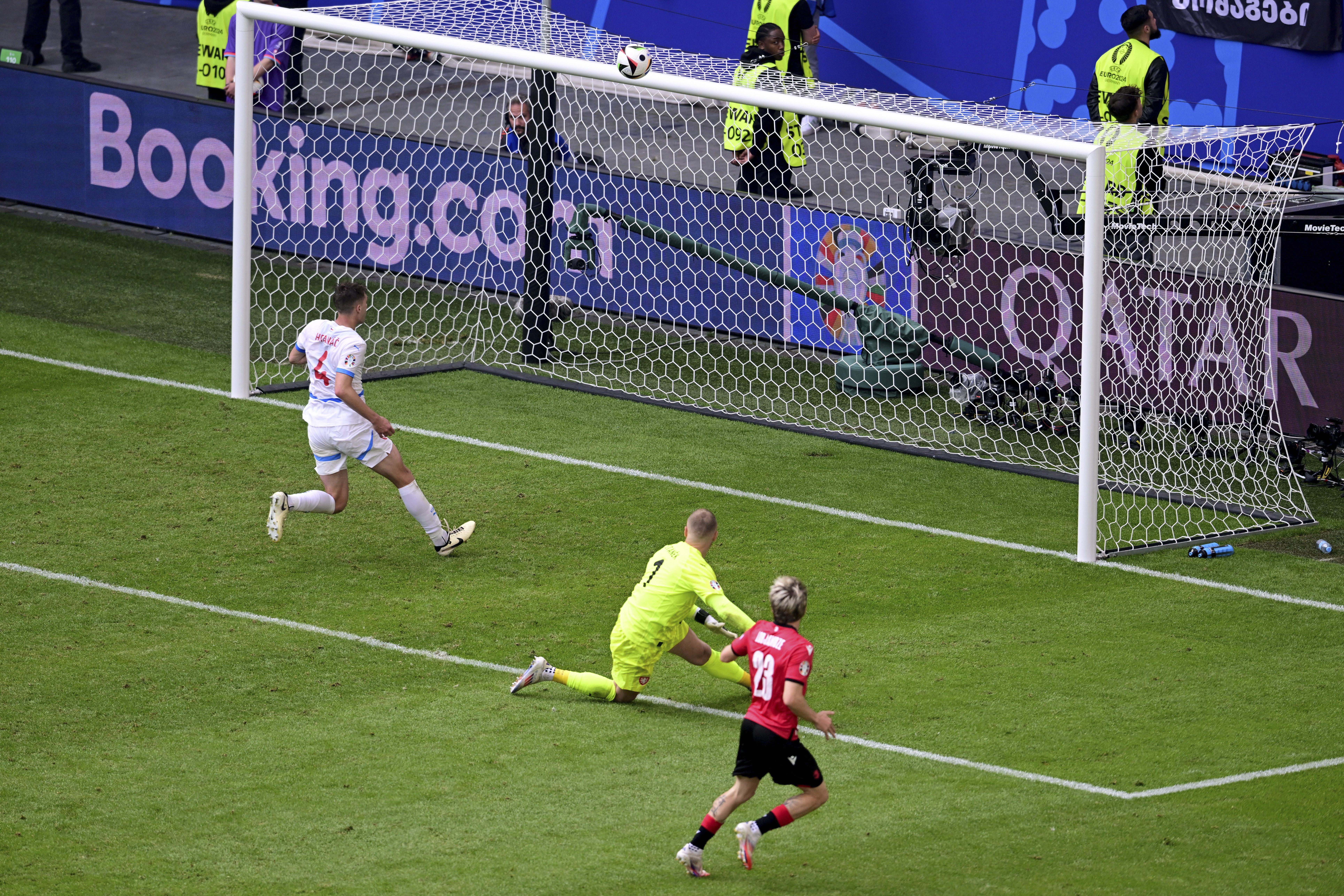 Georgia's Saba Lobjanidze, front, fails to score at the end of a Group F match between Georgia and the Czech Republic at the Euro 2024 soccer tournament in Hamburg, Germany, Saturday, June 22, 2024. (Sina Schuldt/dpa via AP)
