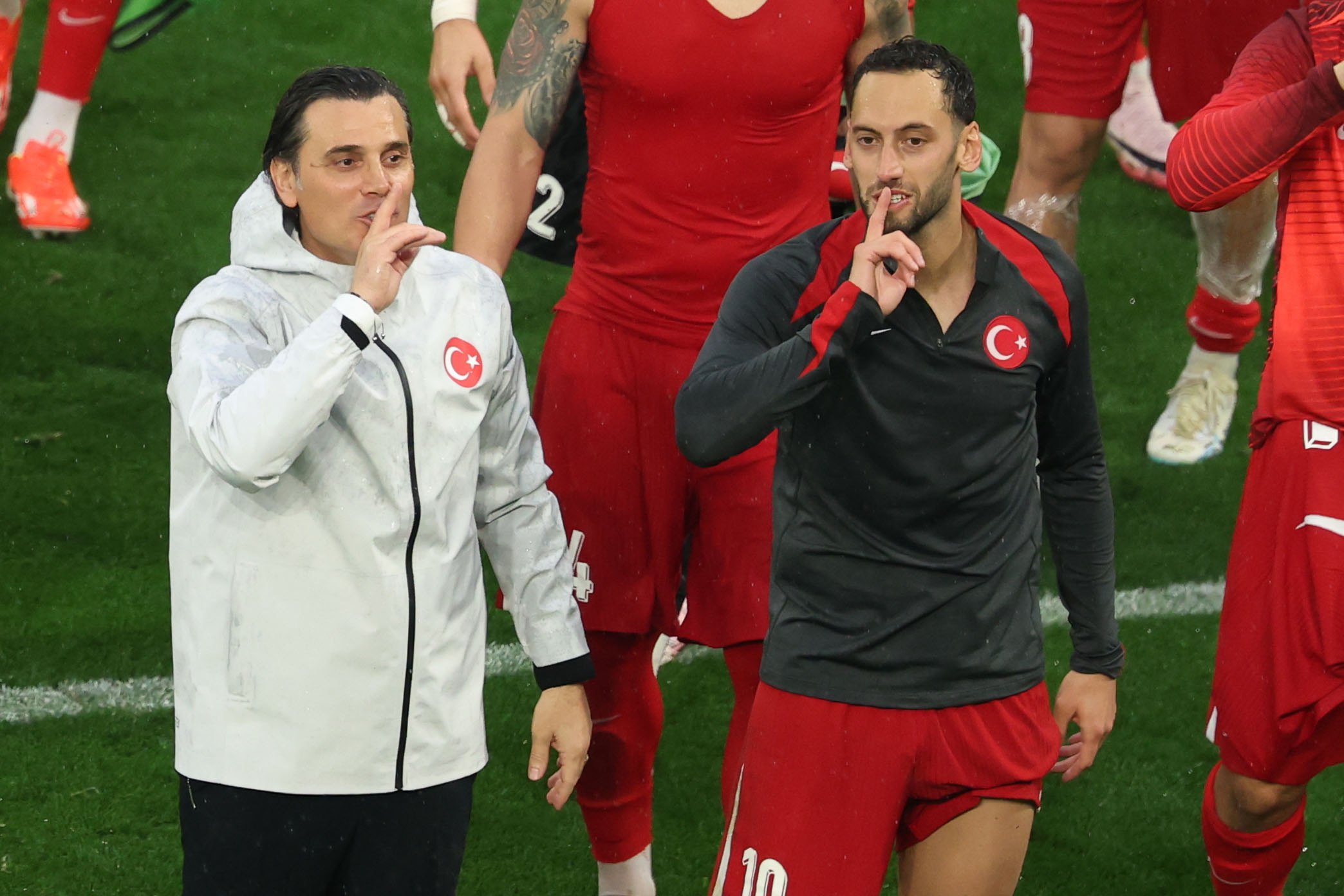 epa11420708 Italian head coach Vincenzo Montella (L) of Turkey celebrates with player Hakan Calhanoglu (R) after winning the UEFA EURO 2024 group F soccer match between Turkey and Georgia, in Dortmund, Germany, 18 June 2024.  EPA-EFE/FRIEDEMANN VOGEL