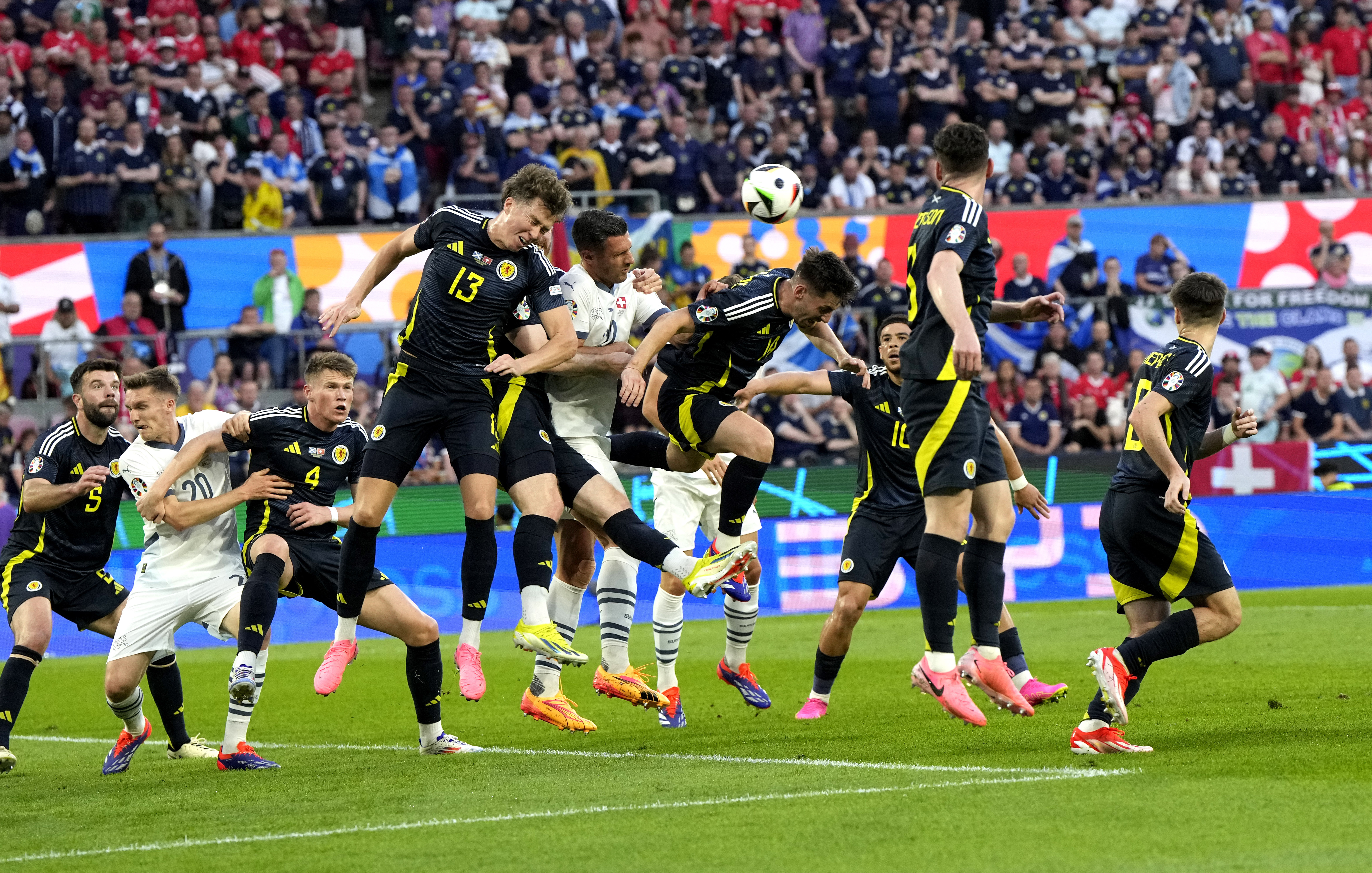 Switzerland's Xherdan Shaqiri, centre, scores his side's equalising goal during a Group A match between Scotland and Switzerland at the Euro 2024 soccer tournament in Cologne, Germany, Wednesday, June 19, 2024. (AP Photo/Martin Meissner)