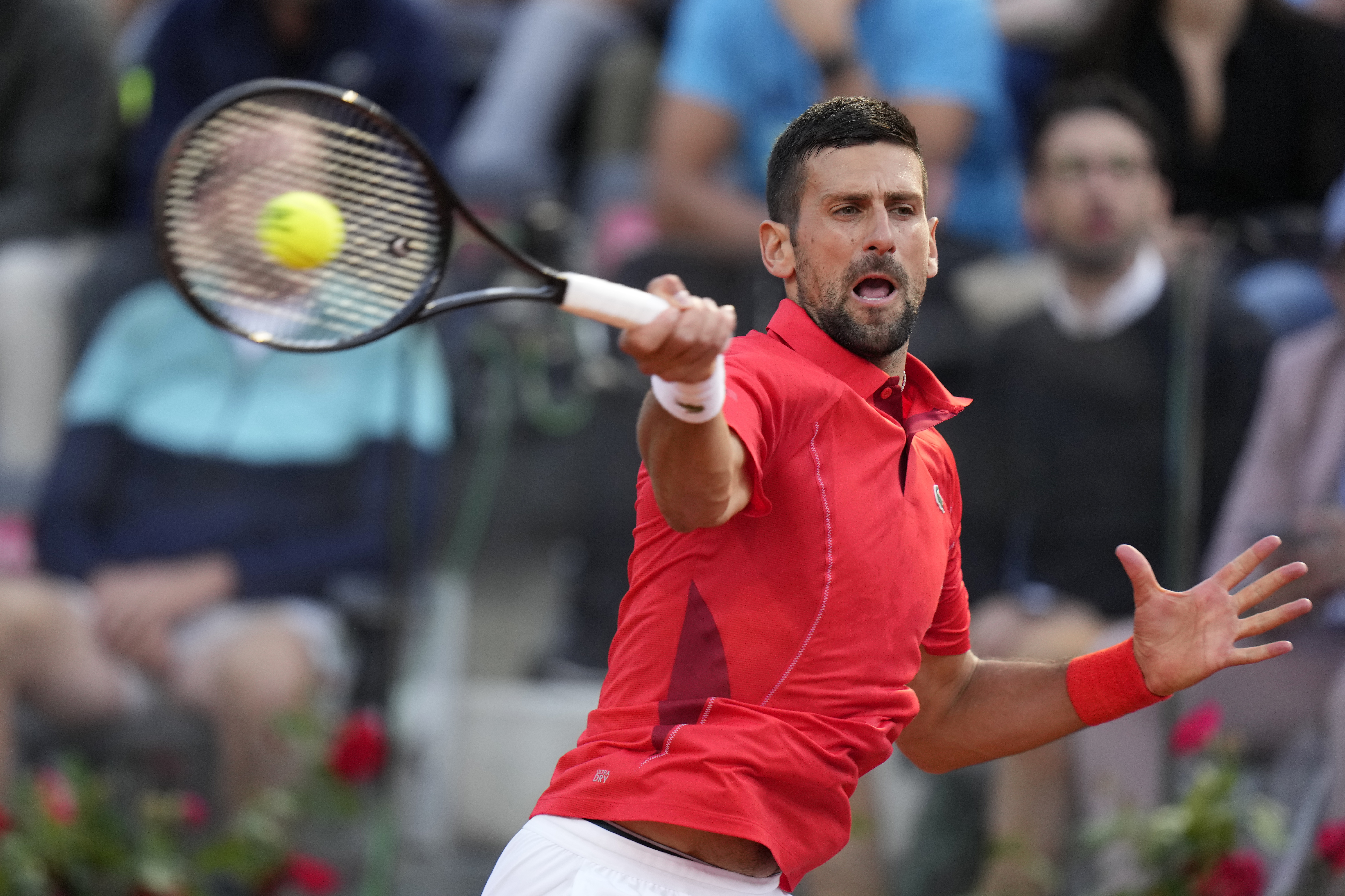 Serbia's Novak Djokovic returns the ball to France's Corentin Moutet at the Italian Open tennis tournament in Rome, Friday, May 10, 2024. (AP Photo/Alessandra Tarantino)