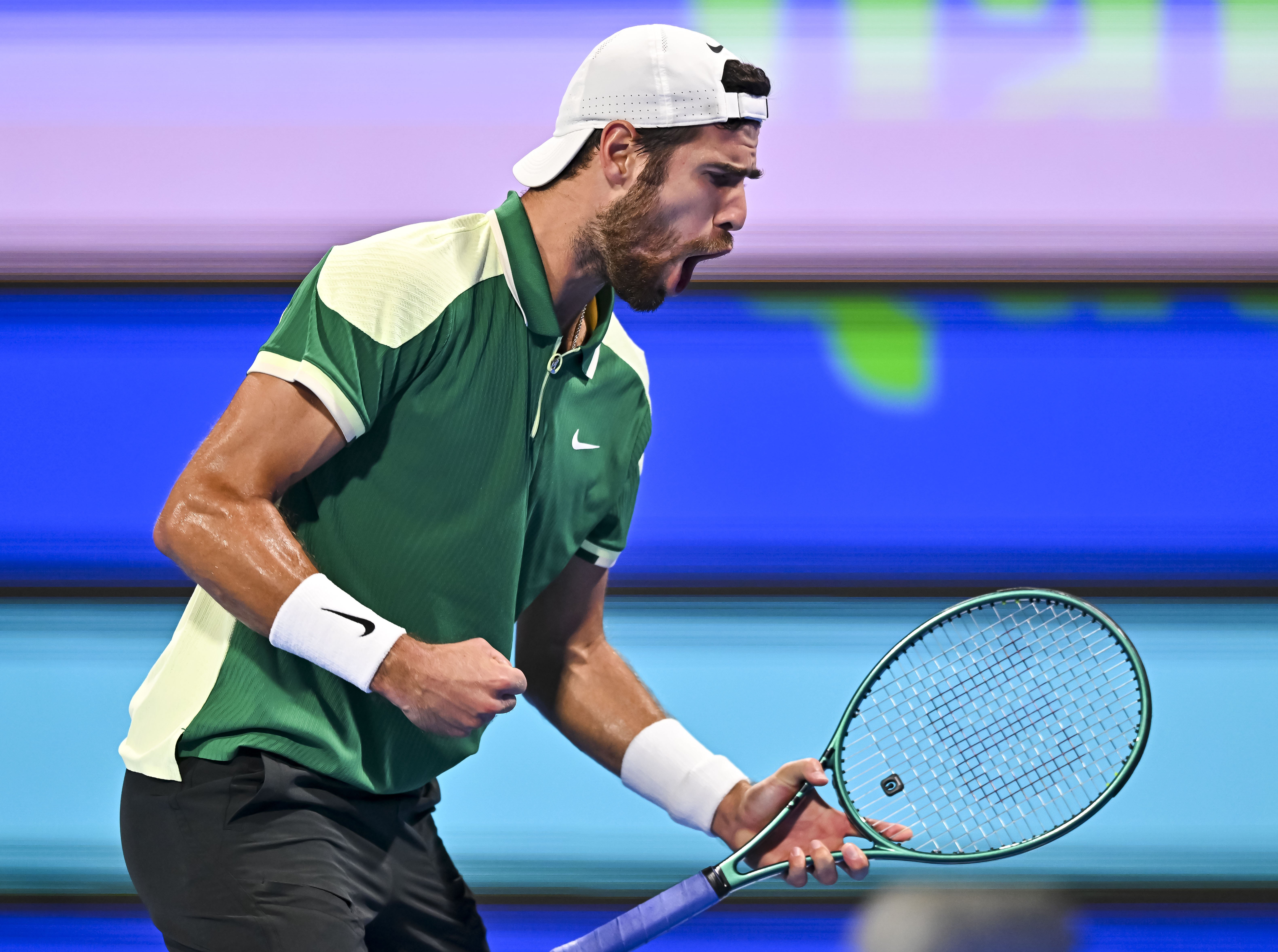 epa11178120 Karen Khachanov of Russia in action against Jakub Mensik of the Czech Republic during their final match at the Qatar Open tennis tournament in Doha, Qatar, 24 February 2024.  EPA-EFE/NOUSHAD THEKKAYIL