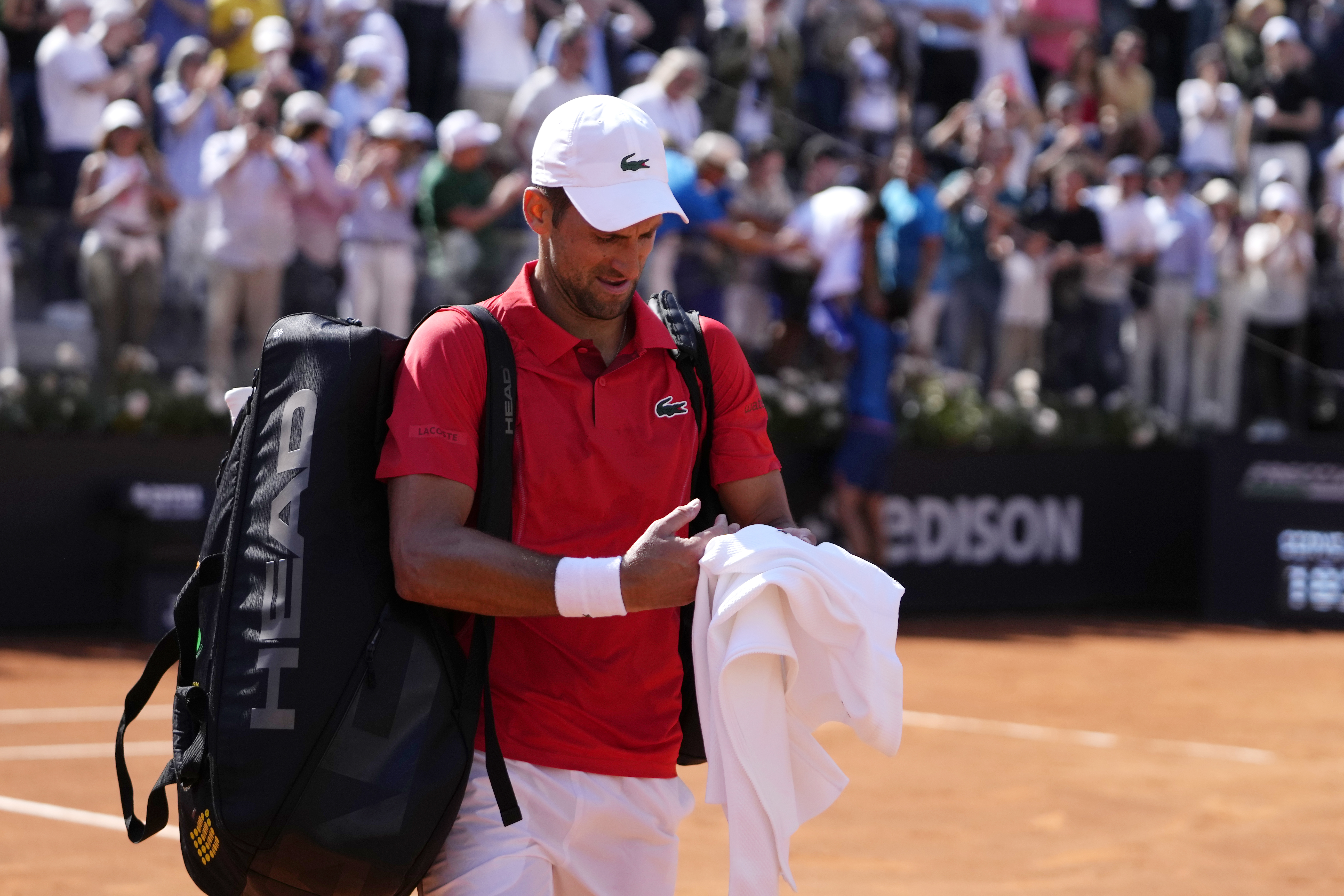 Serbia's Novak Djokovic leaves the field after losing the match against Chile's Alejandro Tabilo at the Italian Open tennis tournament in Rome, Sunday, May 12, 2024. (AP Photo/Alessandra Tarantino)
