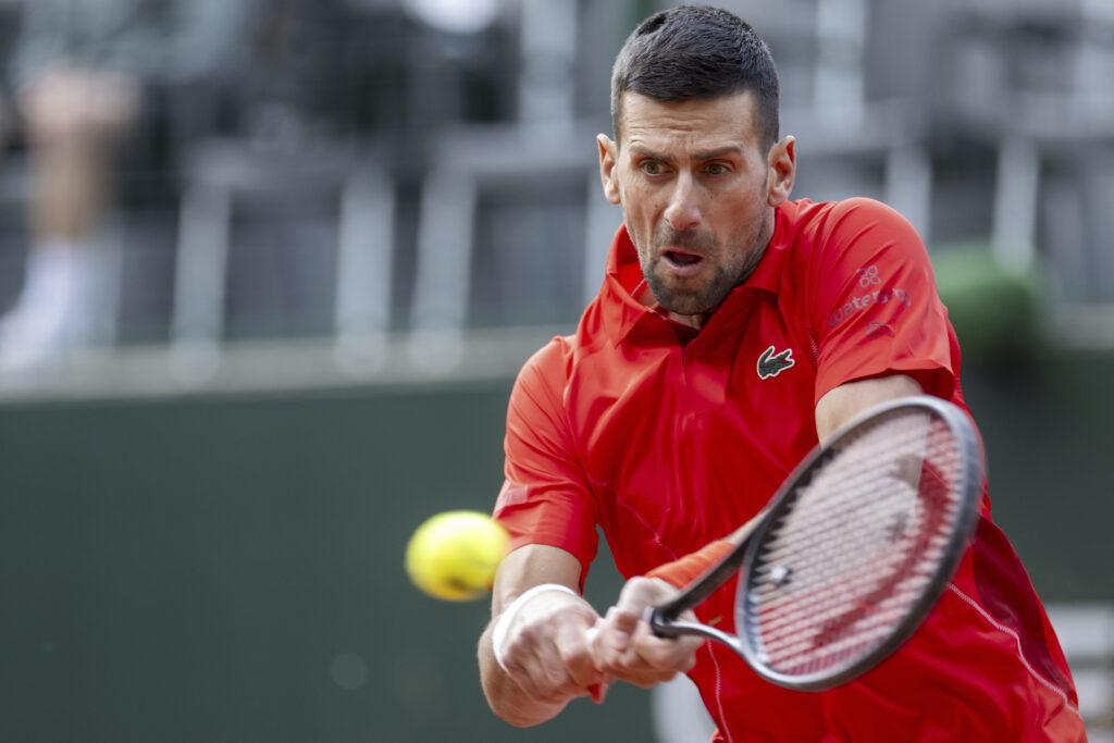 Serbia's Novak Djokovic returns a ball to Tallon Griekspoor from the Netherlands during their quarter final match of the ATP 250 Geneva Open tennis tournament in Geneva, Switzerland, Thursday, May 23, 2024. (Martial Trezzini/Keystone via AP)