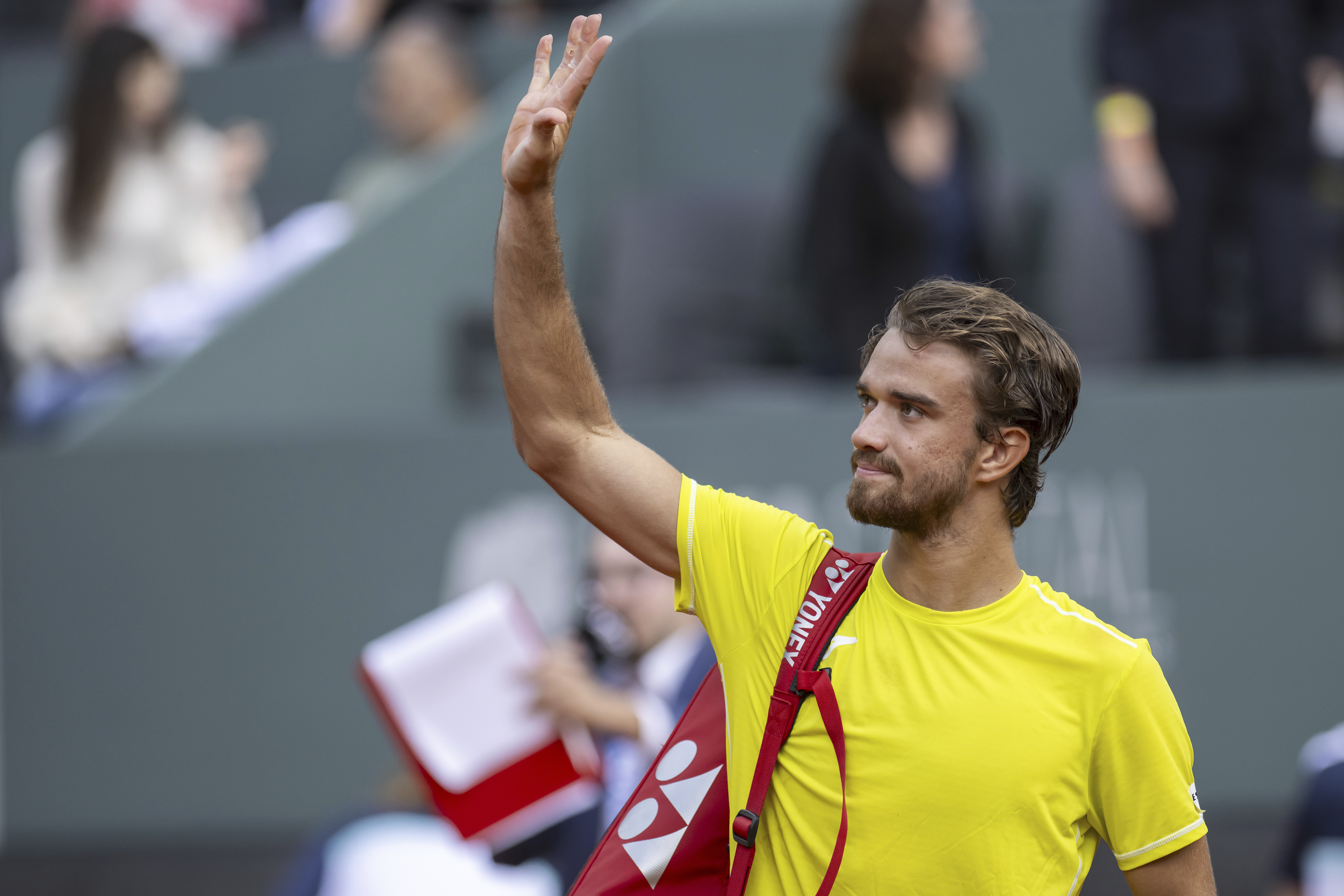 Tomas Machac, of the Czech Republic, reacts after winning against Novak Djokovic, of Serbia, during their semi-final match, at the ATP 250 Geneva Open tennis tournament in Geneva, Switzerland, Friday, May 24, 2024. (Martial Trezzini/Keystone via AP)