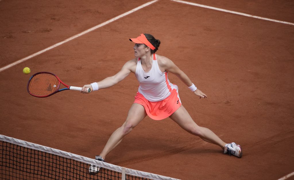 Slovenia's Tamara Zidansek plays a return to Romania's Sorana Cirstea during their fourth round match on day 8, of the French Open tennis tournament at Roland Garros in Paris, France, Sunday, June 6, 2021. (AP Photo/Christophe Ena)