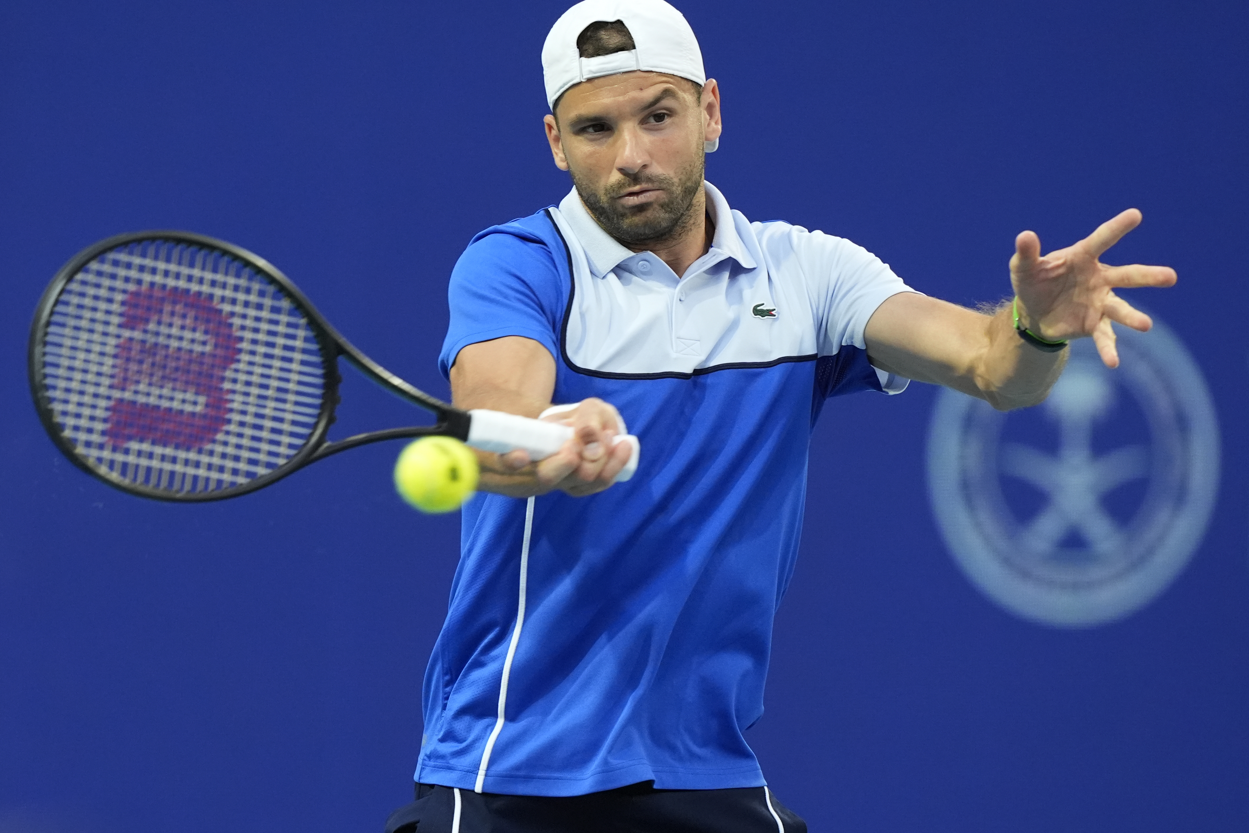 Grigor Dimitrov, of Bulgaria, hits a forehand to Alexander Zverev, of Germany, during the Miami Open tennis tournament Friday, March 29, 2024, in Miami Gardens, Fla. (AP Photo/Marta Lavandier)