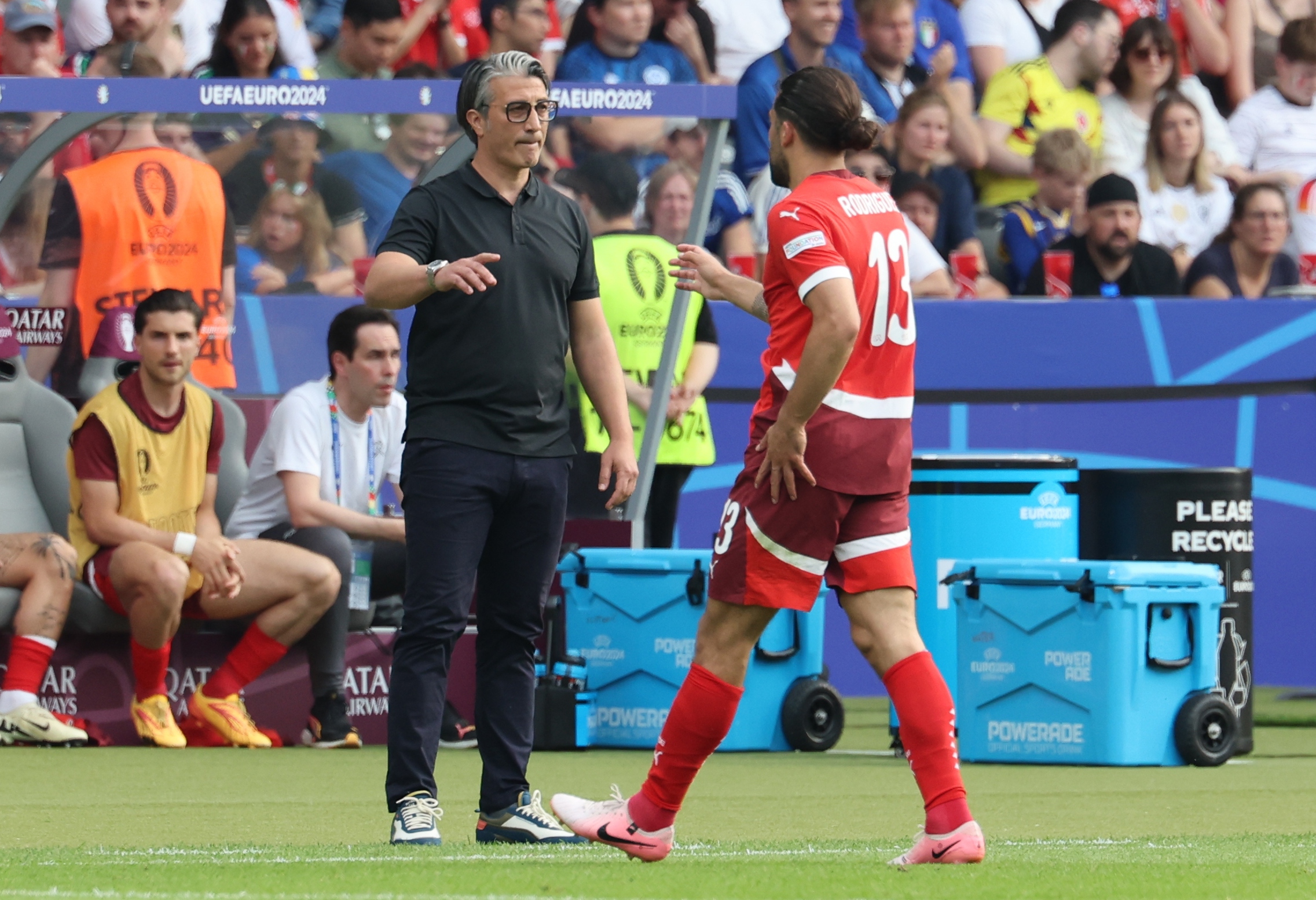 epa11445373 Switzerland head coach Murat Yakin (L) and player Ricardo Rodriguez talk during the UEFA EURO 2024 Round of 16 soccer match between Switzerland and Italy, in Berlin, Germany, 29 June 2024.  EPA-EFE/ABEDIN TAHERKENAREH