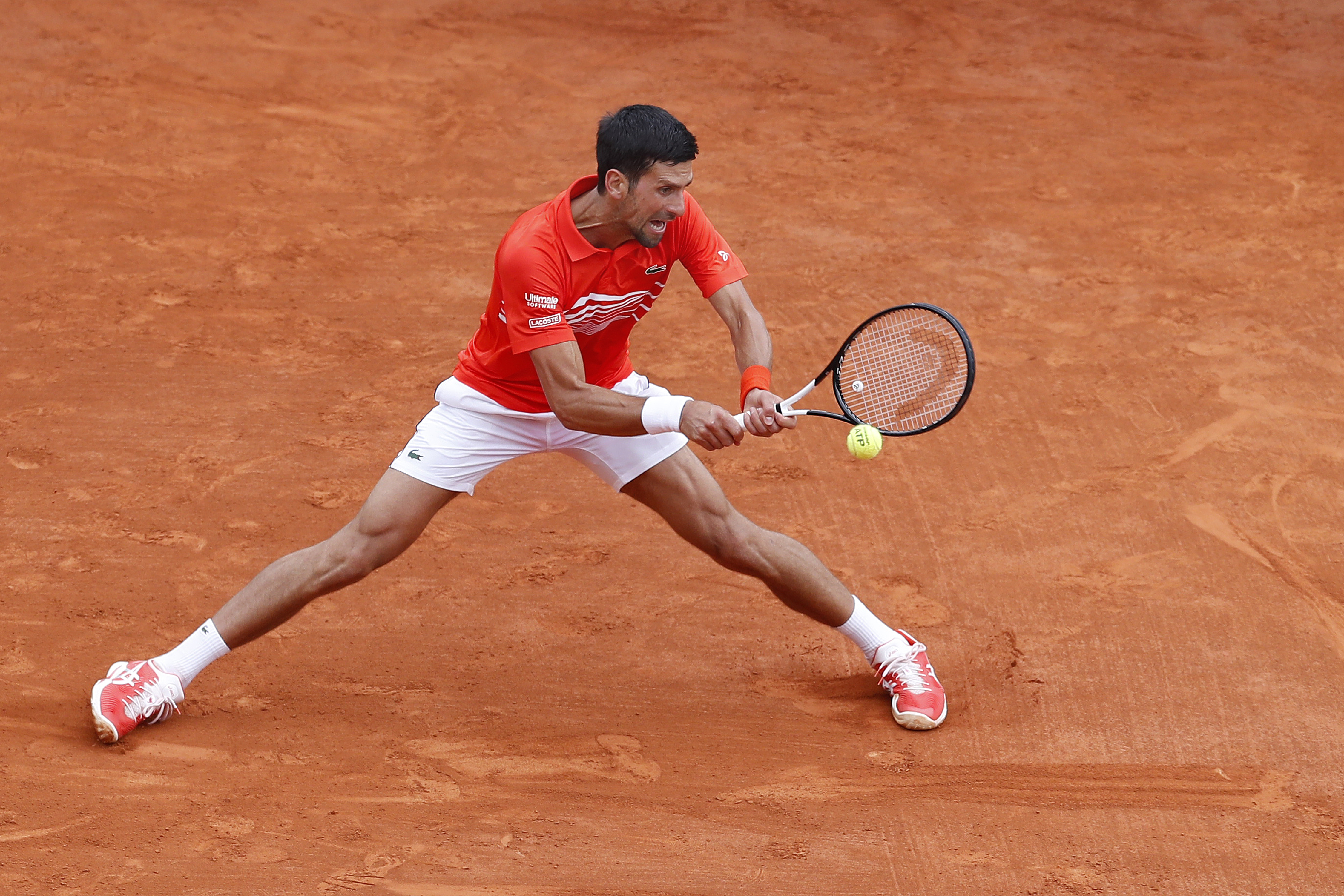 epa07510339 Novak Djokovic of Serbia in action during his second round match against Philipp Kohlschreiber of Germany at the Monte-Carlo Rolex Masters tournament in Roquebrune Cap Martin, France, 16 April 2019.  EPA-EFE/SEBASTIEN NOGIER