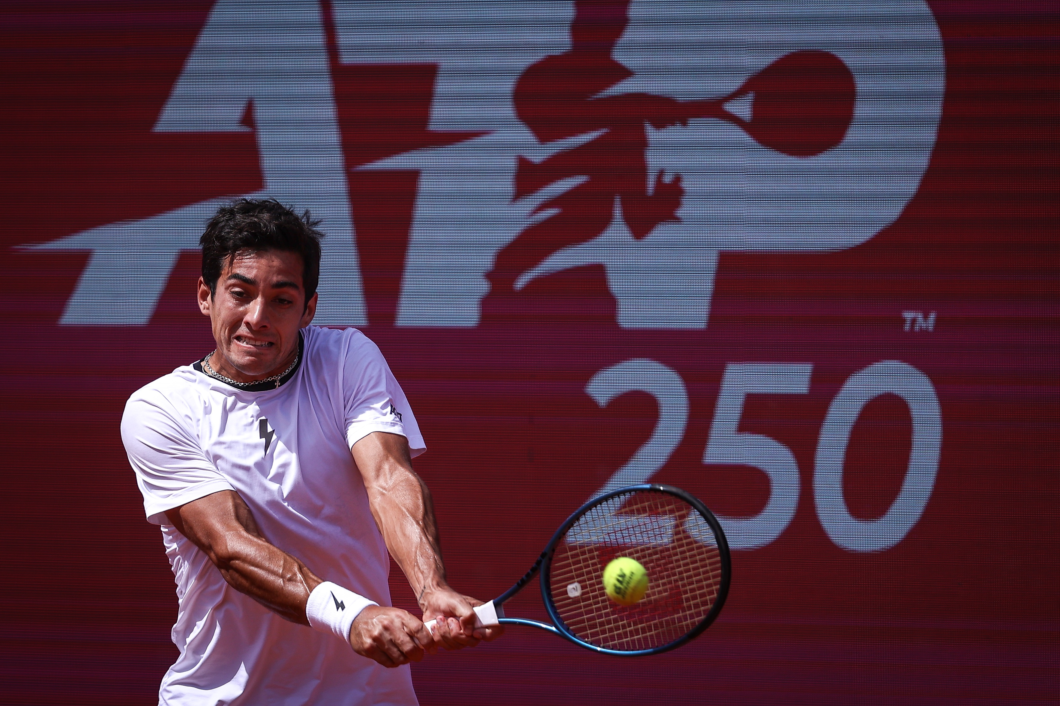 epa11260768 Cristian Garin of Chile in action during his quarterfinal match against Nuno Borges of Portugal on the fifth day of the Estoril Open tennis tournament, in Cascais, Portugal, 05 April 2024.  EPA-EFE/RODRIGO ANTUNES