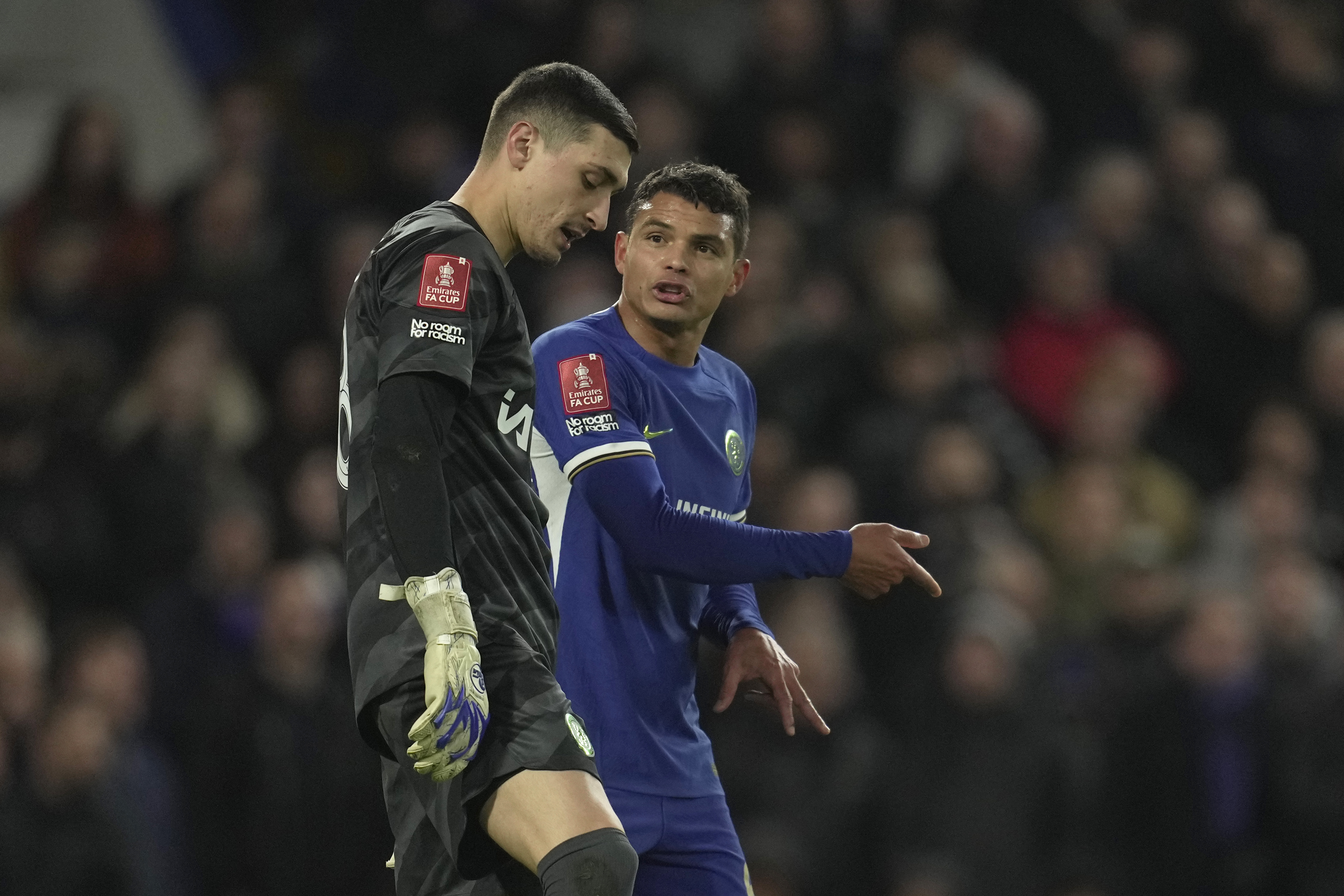 Chelsea's Thiago Silva, right, speaks with his goalkeeper Djordje Petrovic during the English FA Cup fourth round soccer match between Chelsea and Aston Villa at the Stamford Bridge stadium in London, Friday, Jan. 26, 2024. (AP Photo/Kin Cheung)