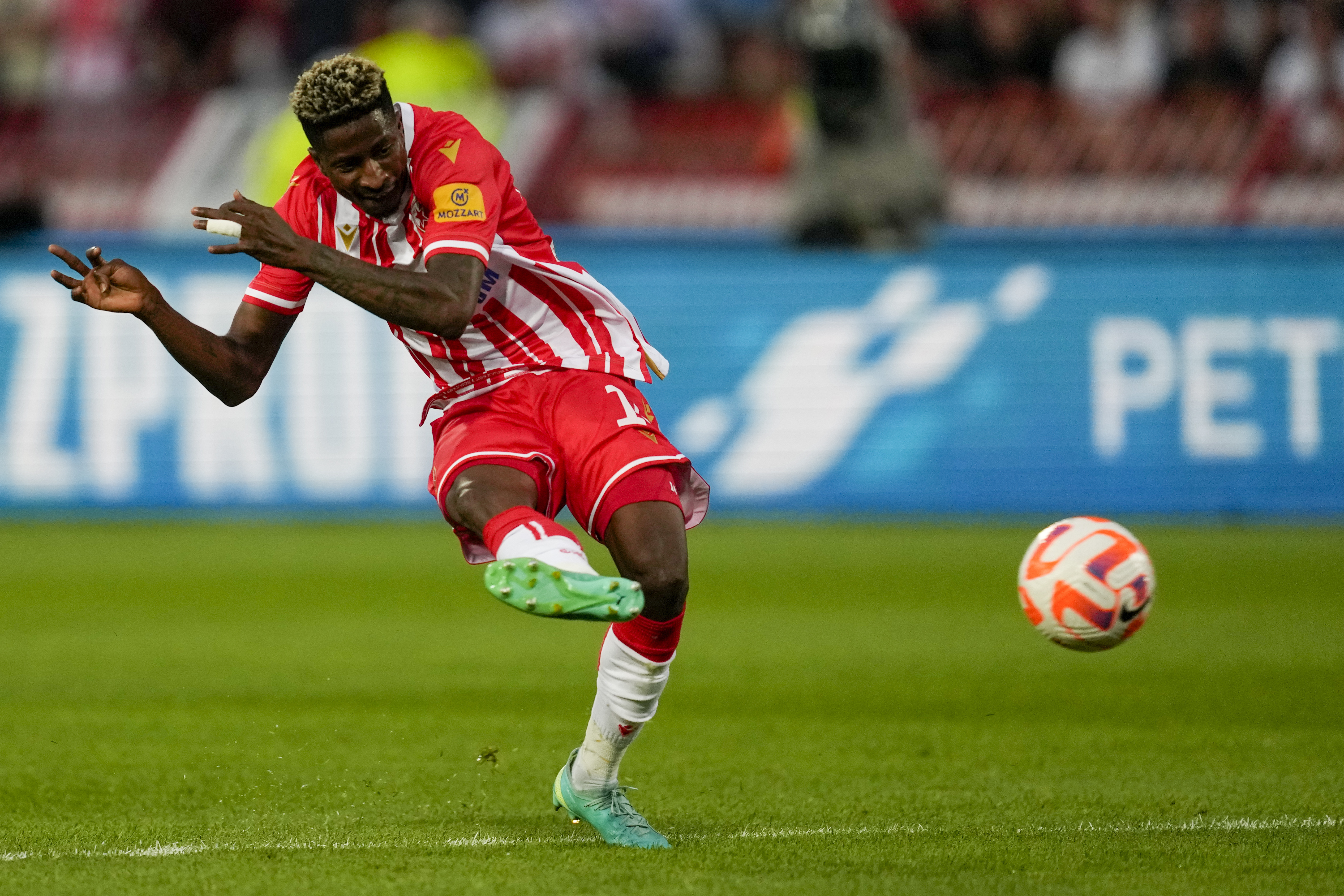 Red Star's Peter Olayinka scores his side's opening goal during an international friendly soccer match between Red Star and Fiorentina at the Rajko Mitic Stadium in Belgrade, Serbia, Wednesday, July 26, 2023. (AP Photo/Darko Vojinovic)