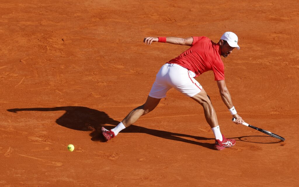 epa11276618 Novak Djokovic of Serbia in action during his semi final match against Casper Ruud of Norway at the ATP Monte Carlo Masters tennis tournament in Roquebrune Cap Martin, France, 13 April 2024.  EPA-EFE/SEBASTIEN NOGIER
