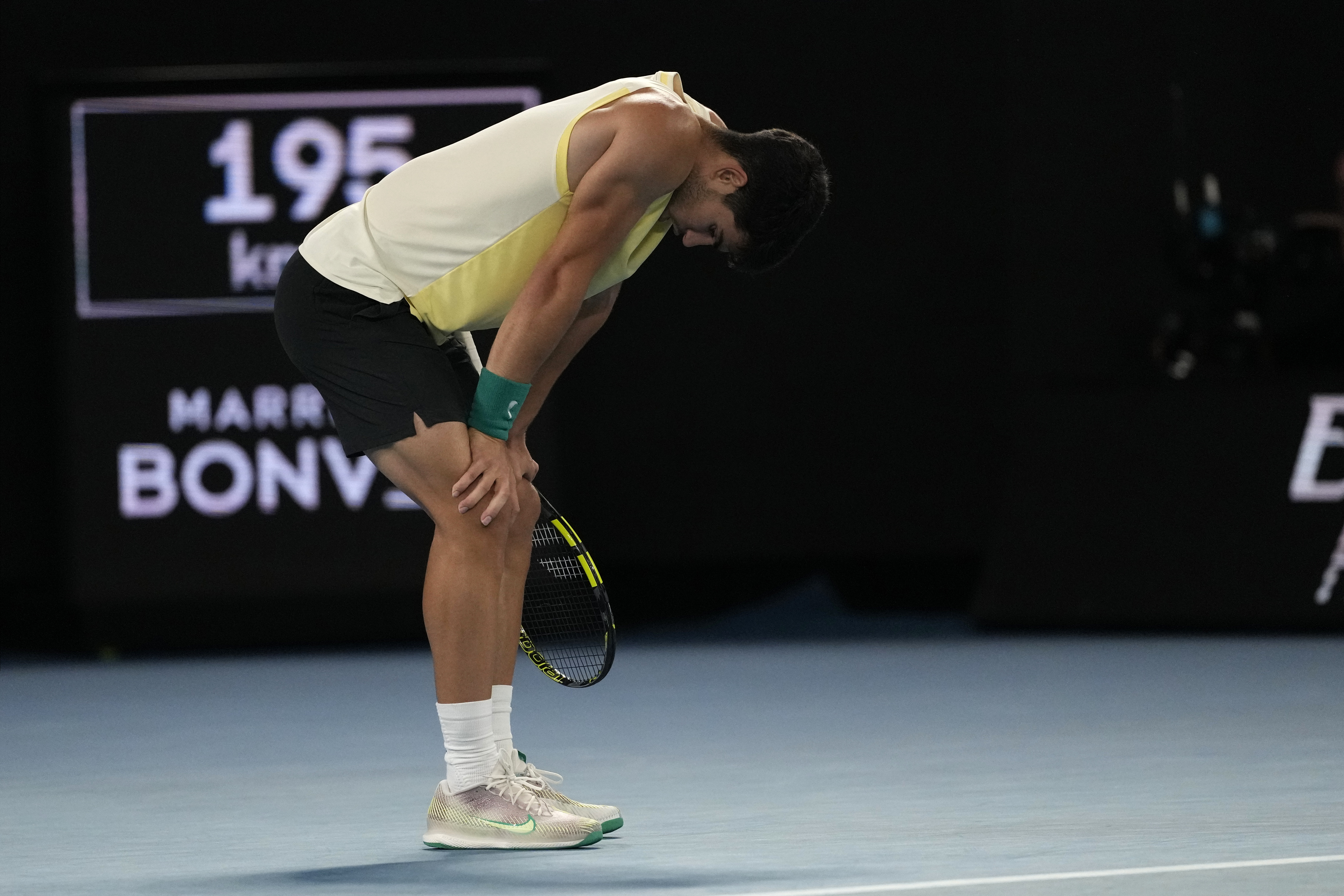 Carlos Alcaraz of Spain reacts during his quarterfinal match against Alexander Zverev of Germany at the Australian Open tennis championships at Melbourne Park, Melbourne, Australia, Wednesday, Jan. 24, 2024. (AP Photo/Alessandra Tarantino)