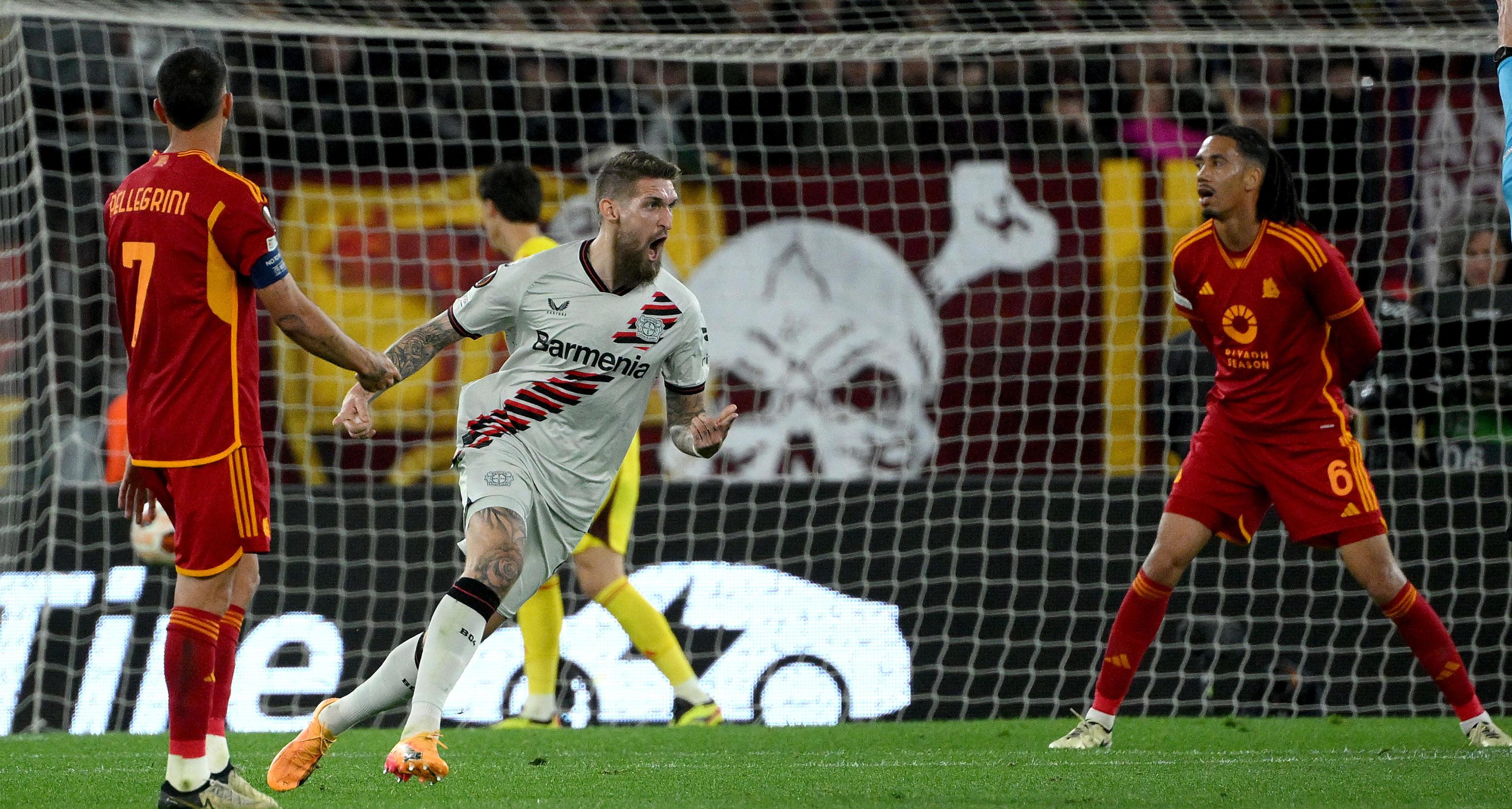 epa11315269 Bayer Leverkusen's Robert Andrich (C) celebrates after scoring the 0-2 goal during the UEFA Europe League semifinal 1st leg soccer match between AS Roma and Bayer Leverkusen, in Rome, Italy, 02 May 2024.  EPA-EFE/ETTORE FERRARI
