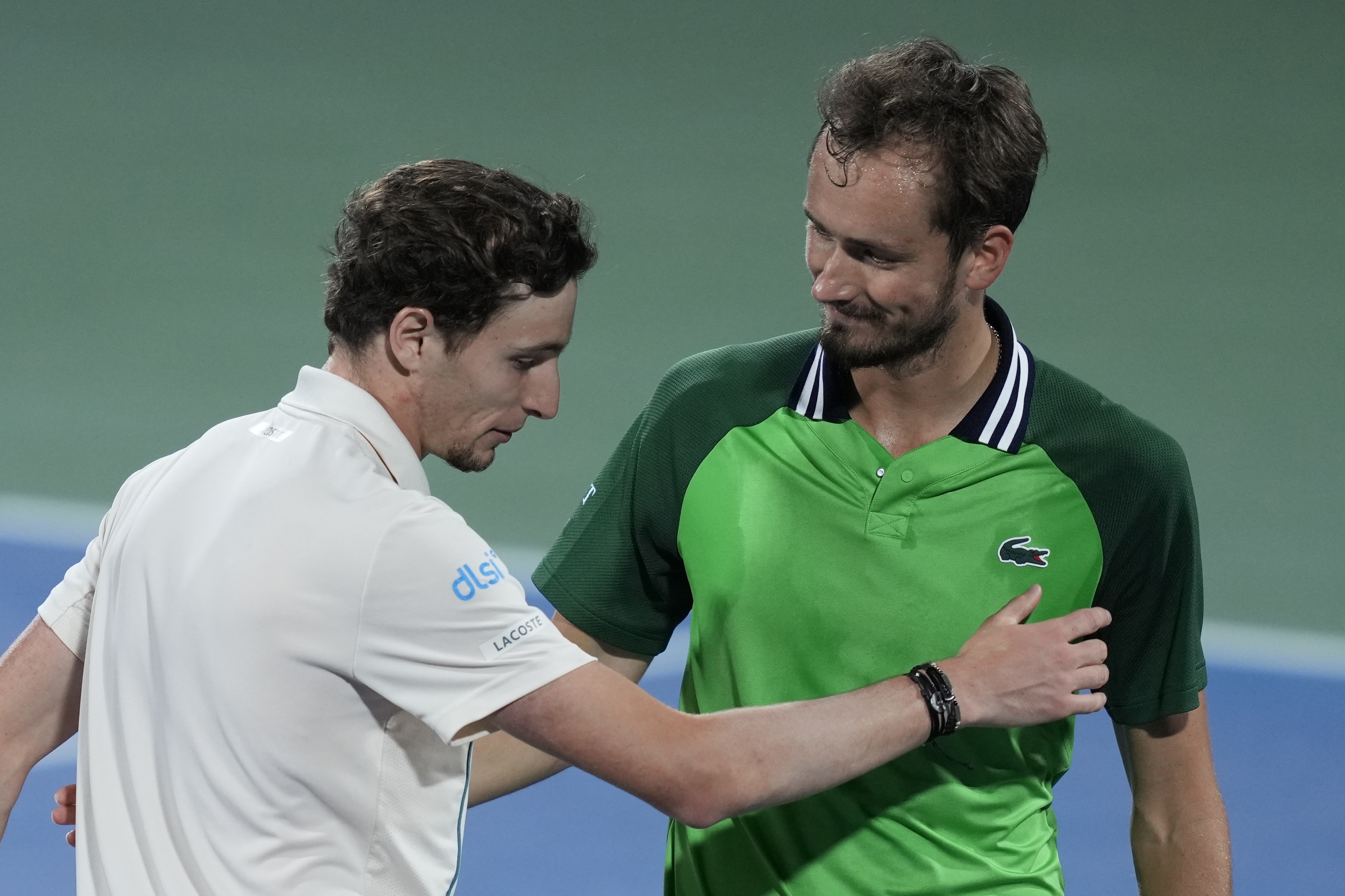 Daniil Medvedev, right, congratulates to Ugo Humbert of France after lost his semi final match of the Dubai Duty Free Tennis Championships in Dubai, United Arab Emirates, Friday, March 1, 2024. (AP Photo/Kamran Jebreili)