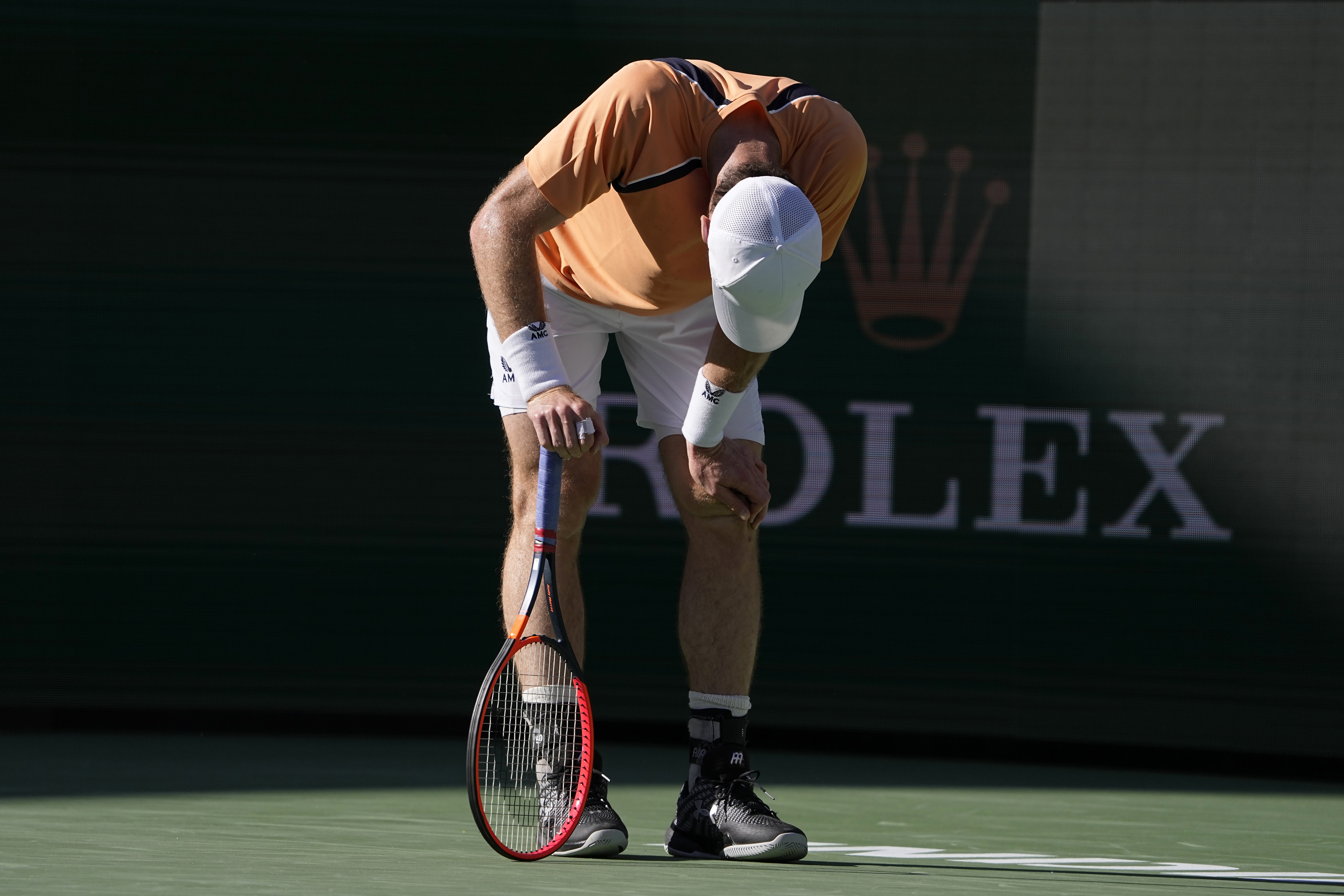 Andy Murray, of Great Britain, rests after losing a point against Andrey Rublev, of Russia, at the BNP Paribas Open tennis tournament in Indian Wells, Calif., Friday, March 8, 2024. (AP Photo/Mark J. Terrill)