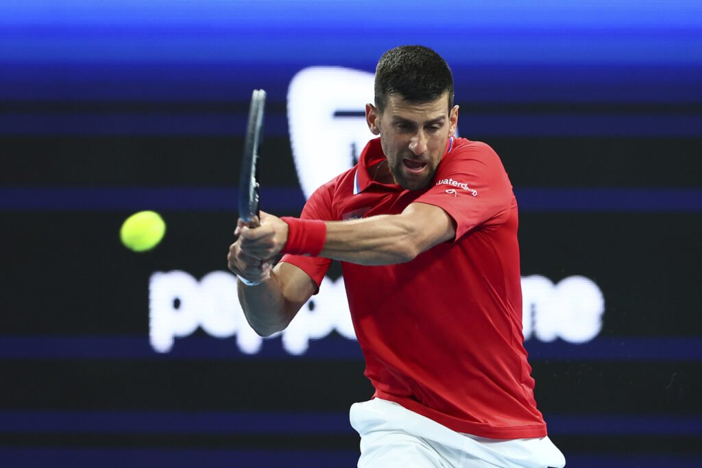Novak Djokovic of Serbia returns the ball to Zhizhen Zhang of China during the United Cup tennis tournament in Perth, Australia, Sunday, Dec. 31, 2023. (AP Photo/Trevor Collens)