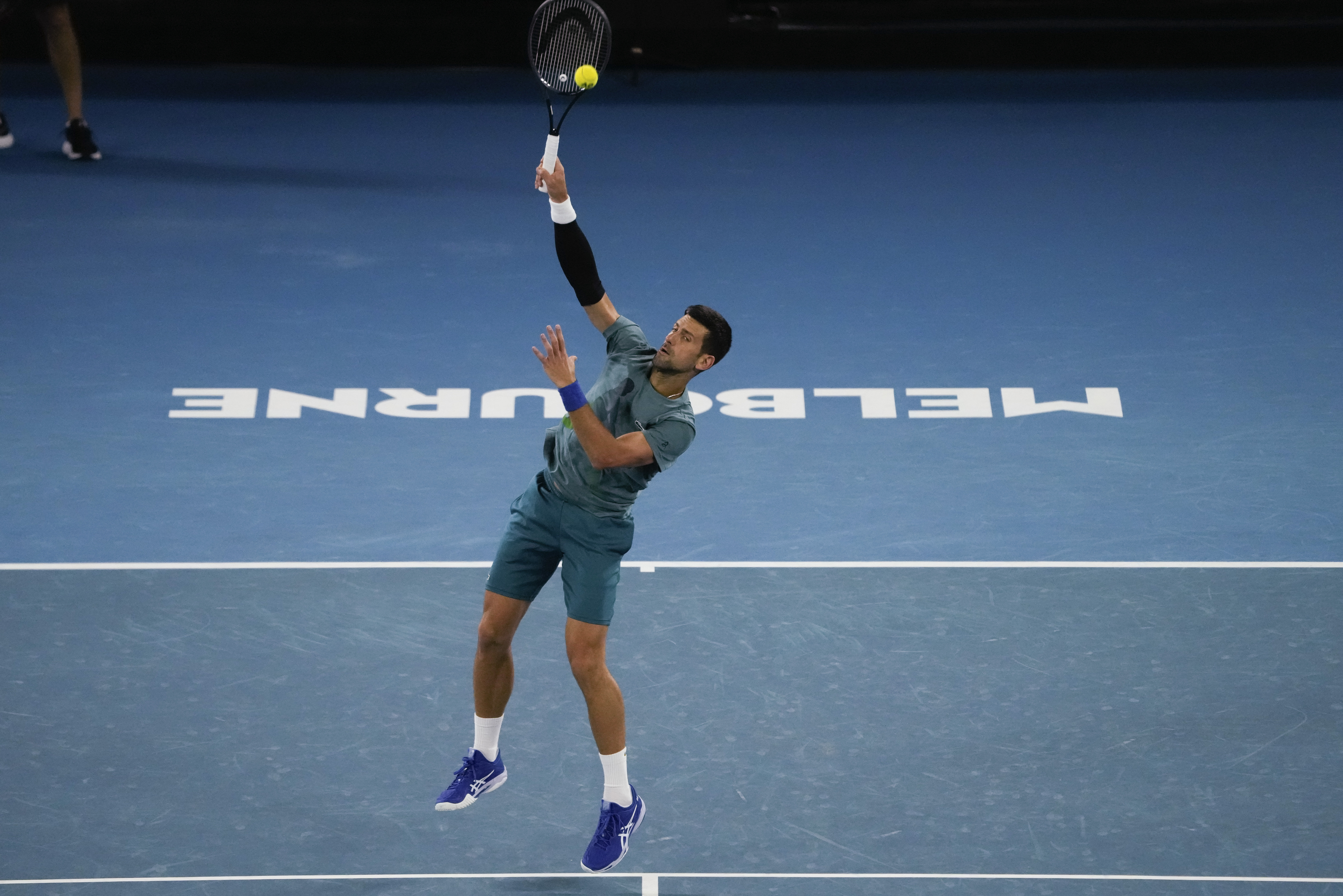 Serbia's Novak Djokovic serves during a practice session ahead of the Australian Open tennis championships at Melbourne Park, Melbourne, Australia, Saturday, Jan. 13, 2024. (AP Photo/Andy Wong)