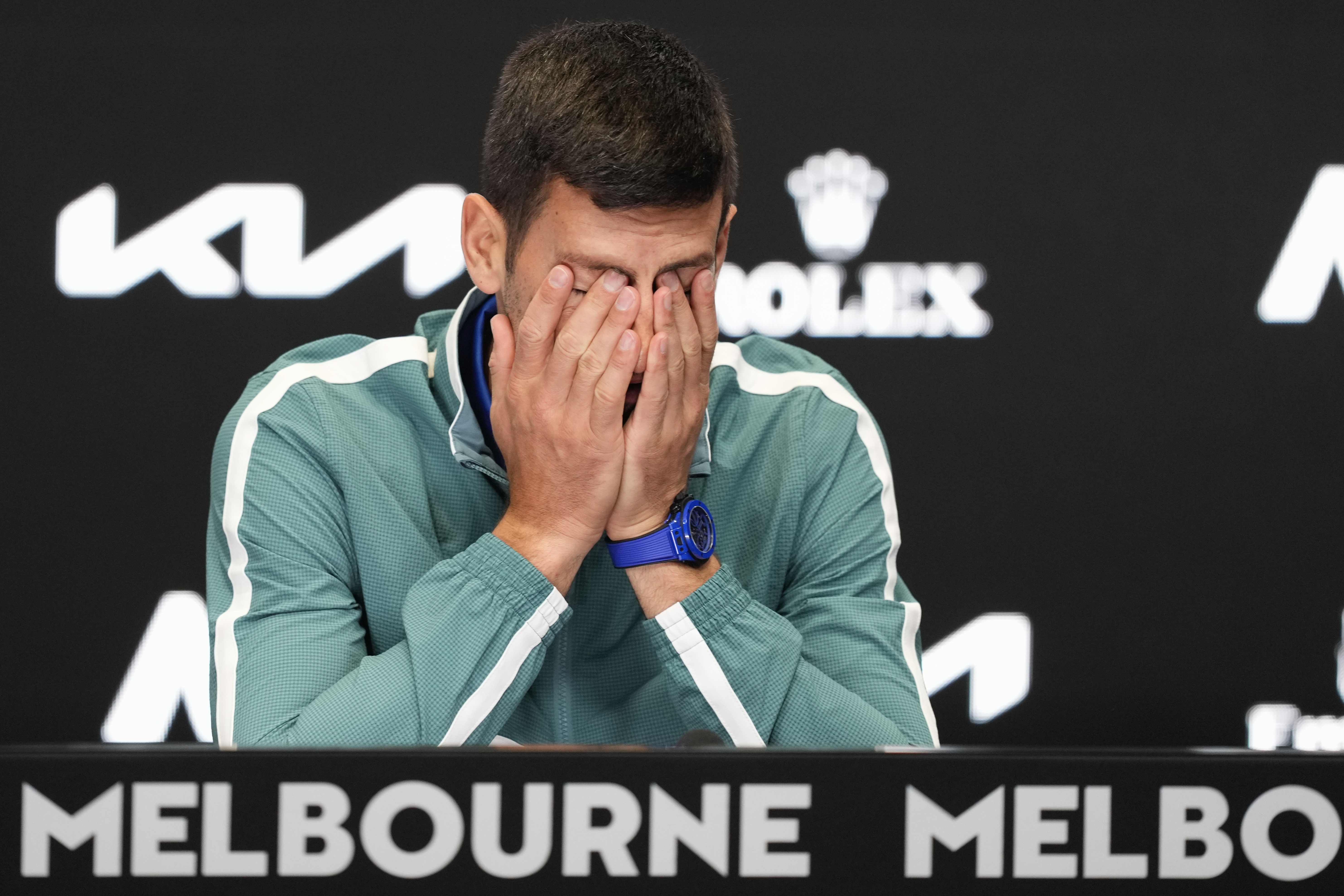Serbia's Novak Djokovic reacts during a press conference ahead of the Australian Open tennis championships at Melbourne Park, Melbourne, Australia, Saturday, Jan. 13, 2024. (AP Photo/Alessandra Tarantino)
