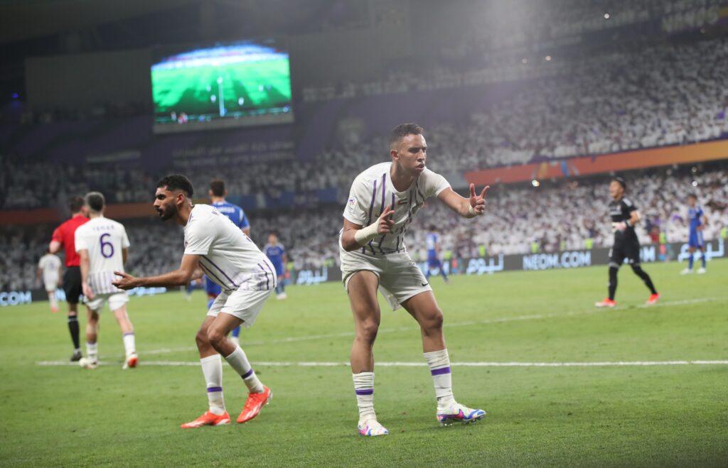 epa11369846 Soufiane Rahimi (R) of Al Ain reacts after scoring a goal during the AFC Champions League final, 2nd leg soccer match of Al Ain against Yokohama F. Marinos, in Al Ain, United Arab Emirates, 25 May 2024.  EPA-EFE/ALI HAIDER