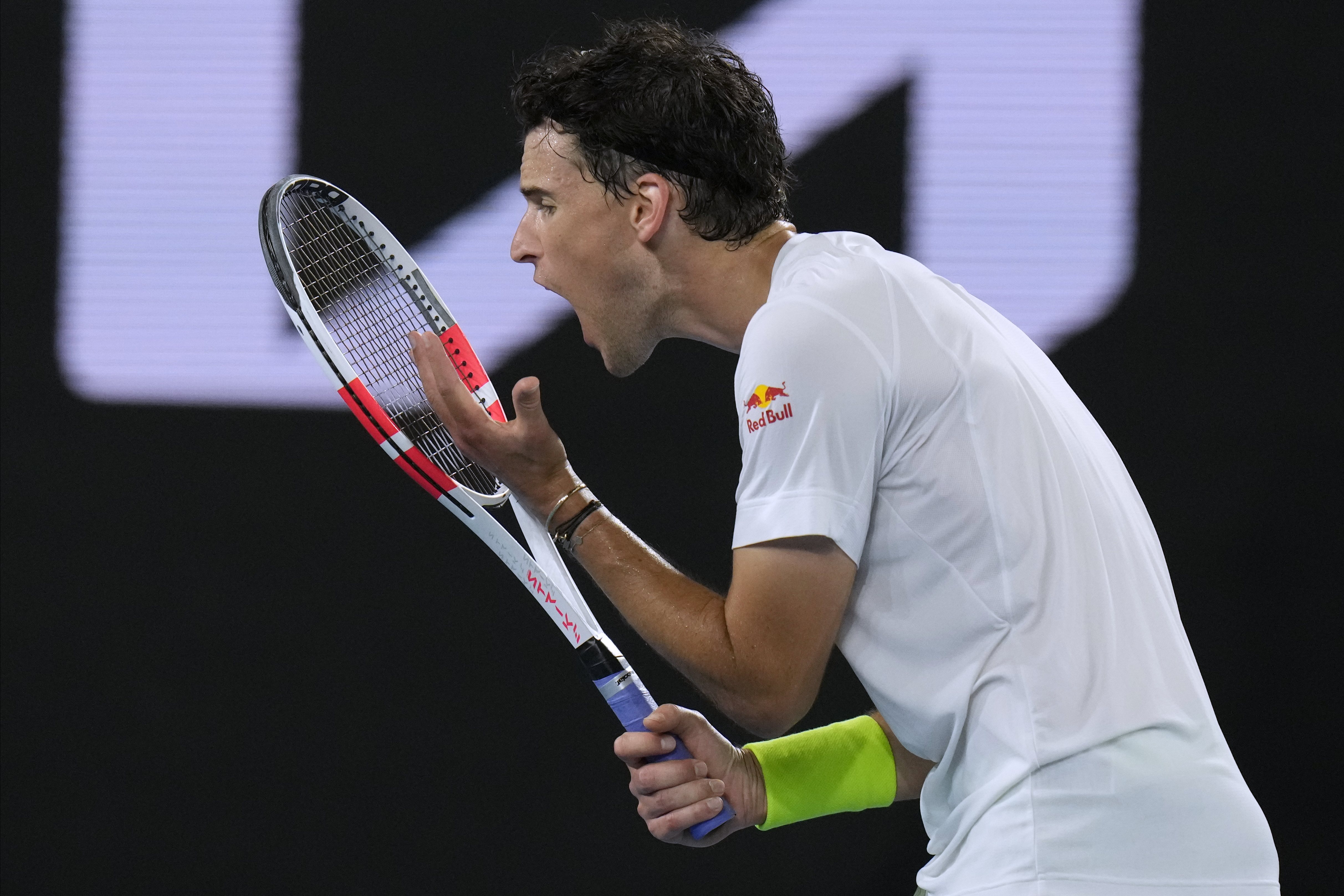 Dominic Thiem of Austria reacts in frustration during his first round match against Felix Auger-Aliassime of Canada at the Australian Open tennis championships at Melbourne Park, Melbourne, Australia, Monday, Jan. 15, 2024. (AP Photo/Andy Wong)
