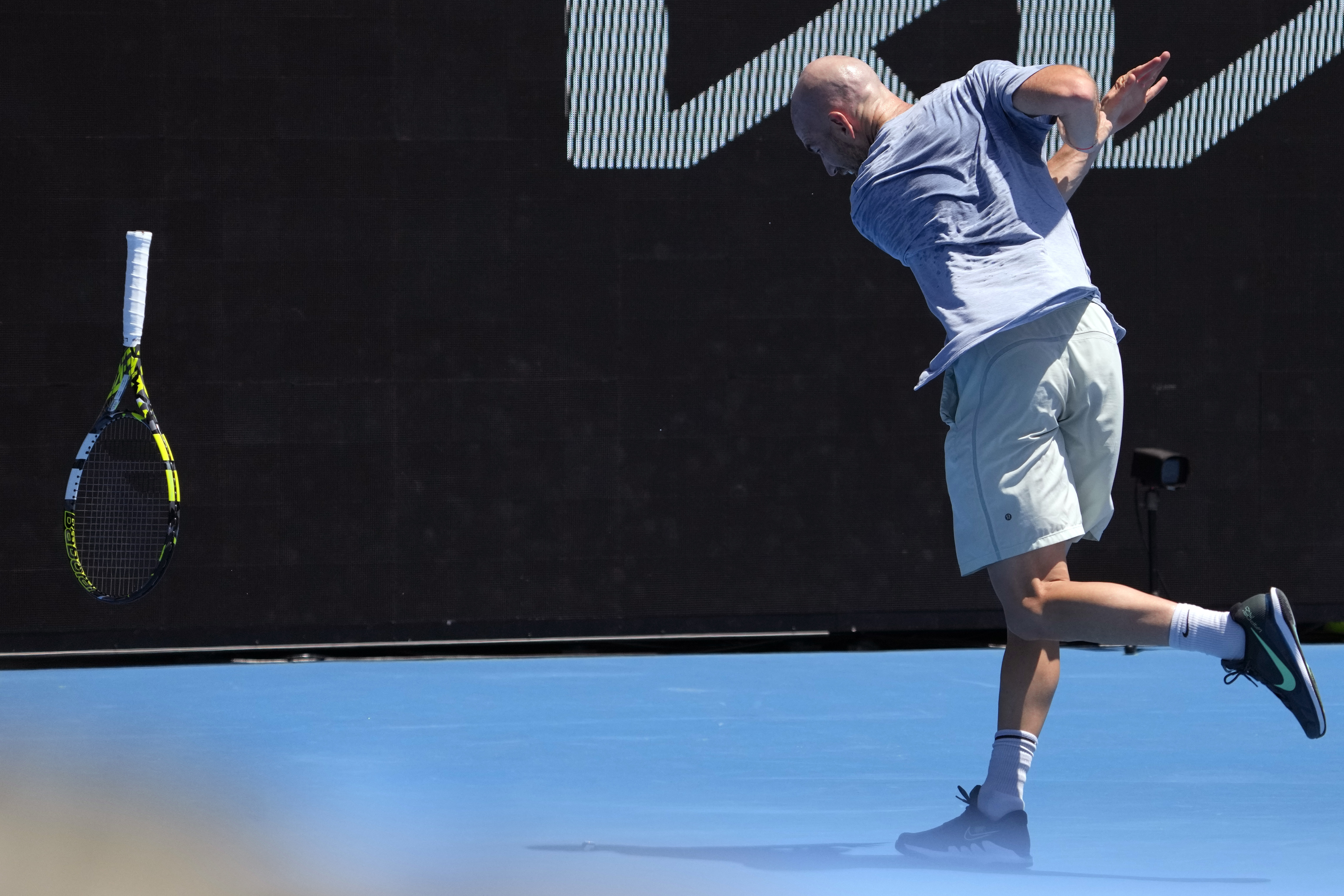 Adrian Mannarino of France throws his racket in frustration during his first round match against Stan Wawrinka of Switzerland at the Australian Open tennis championships at Melbourne Park, Melbourne, Australia, Monday, Jan. 15, 2024. (AP Photo/Andy Wong)