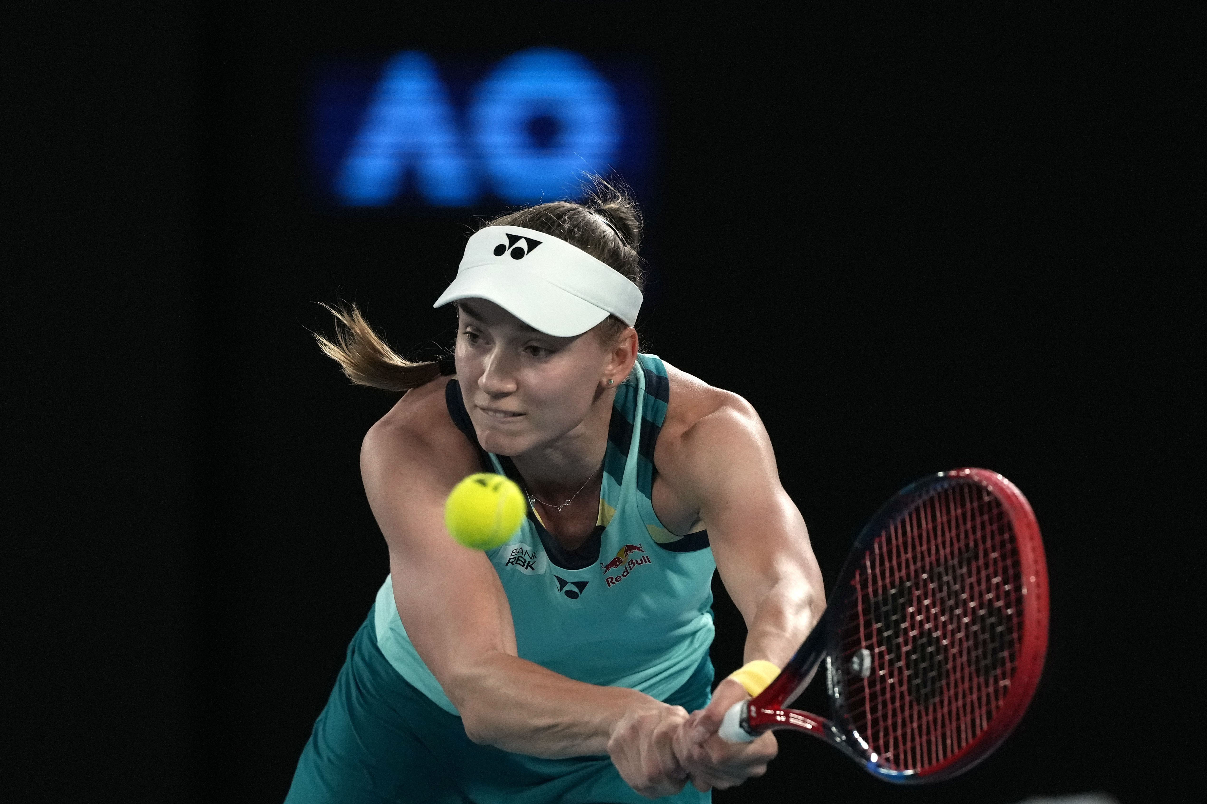 Elena Rybakina of Kazakhstan plays a backhand return to Anna Blinkova of Russia during their second round match at the Australian Open tennis championships at Melbourne Park, Melbourne, Australia, Thursday, Jan. 18, 2024. (AP Photo/Andy Wong)