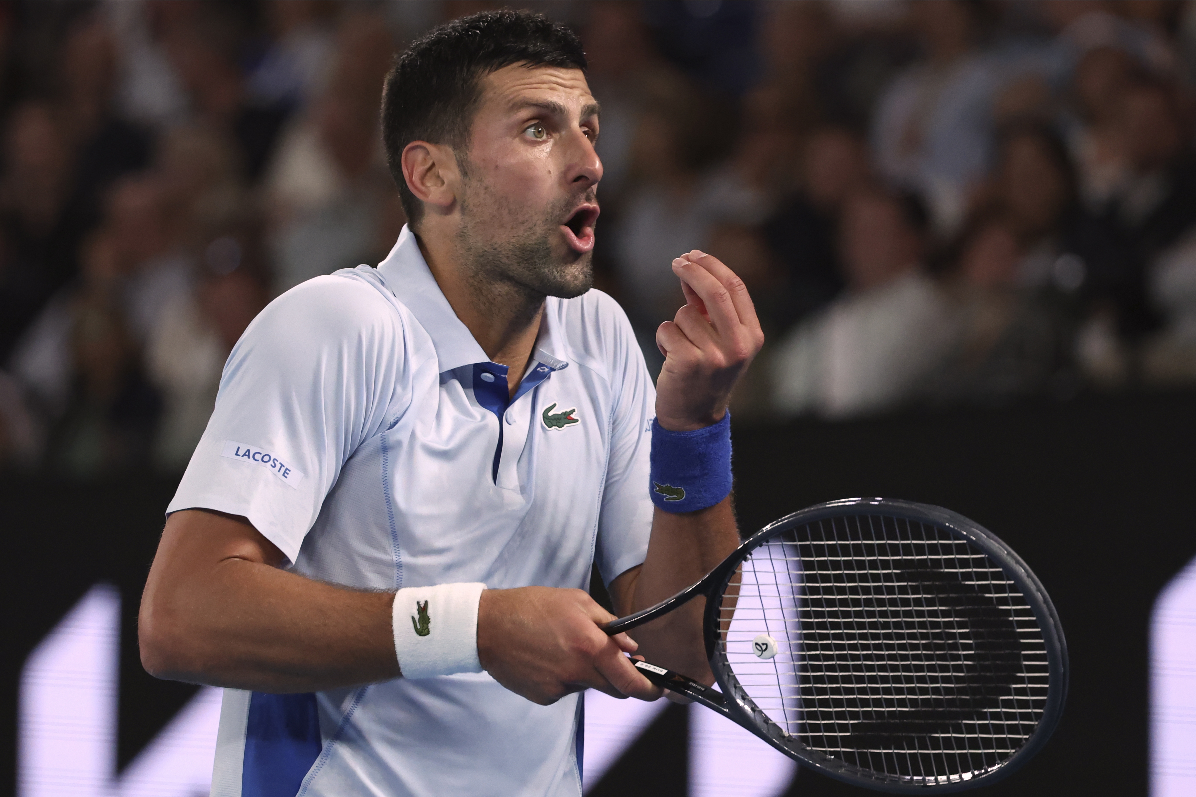Novak Djokovic of Serbia reacts during his fourth round match against Adrian Mannarino of France at the Australian Open tennis championships at Melbourne Park, Melbourne, Australia, Sunday, Jan. 21, 2024. (AP Photo/Asanka Brendon Ratnayake)