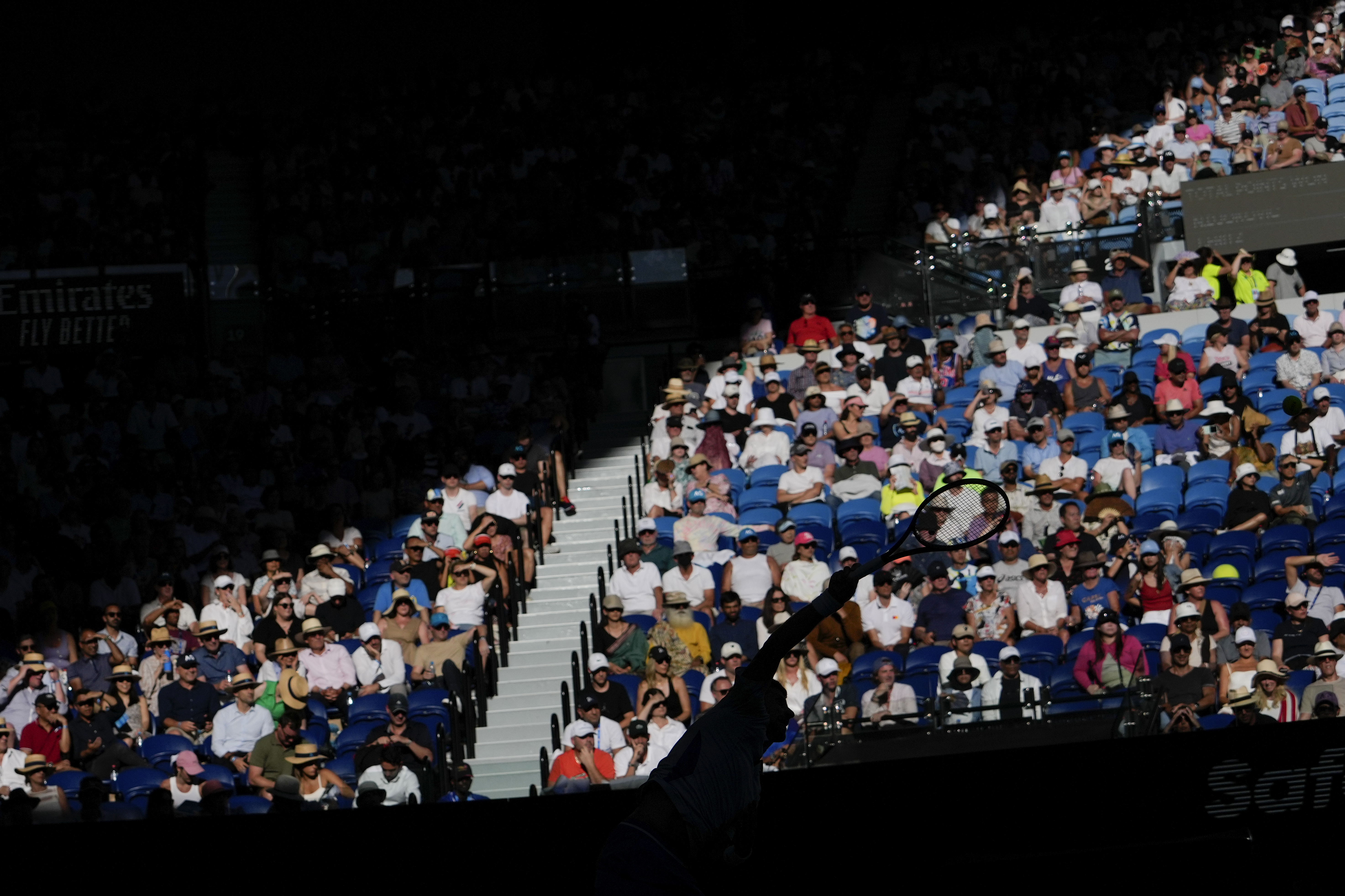 Novak Djokovic of Serbia serves to Taylor Fritz of the U.S. during their quarterfinal match at the Australian Open tennis championships at Melbourne Park, Melbourne, Australia, Tuesday, Jan. 23, 2024. (AP Photo/Andy Wong)