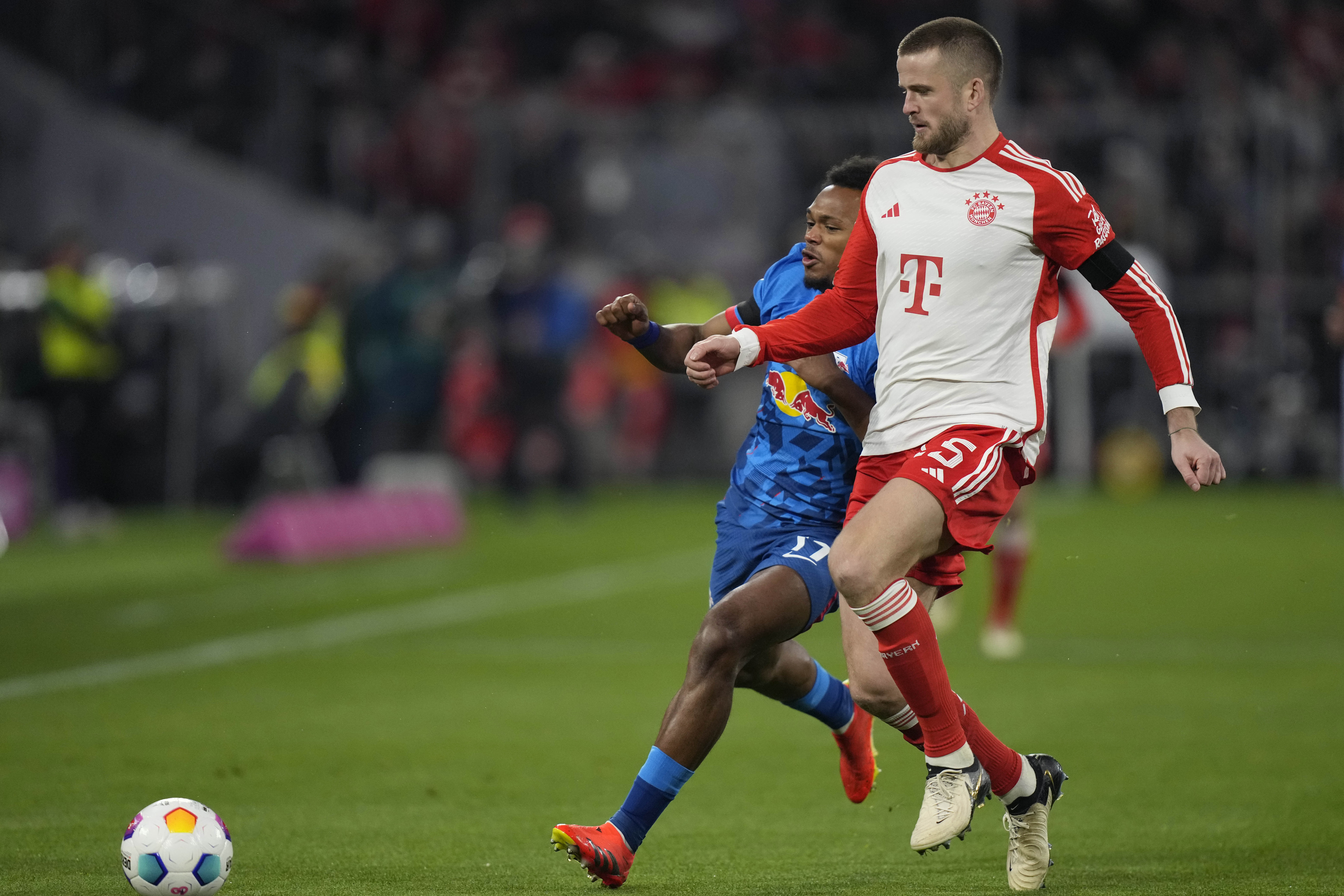 Bayern's Eric Dier, right, and Leipzig's Lois Openda challenge for the ball during the German Bundesliga soccer match between FC Bayern Munich and RB Leipzig at the Allianz Arena in Munich, Germany, Feb. 24, 2024. (AP Photo/Matthias Schrader)