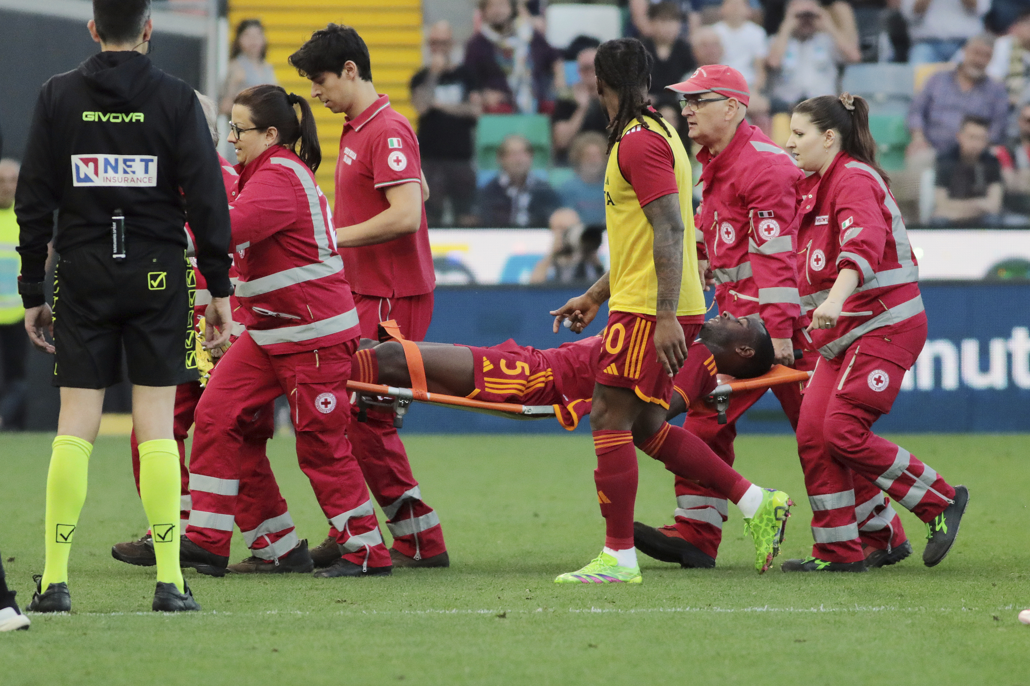 Roma's Evan Ndicka is carried off the pitch on a stretcher during the Serie A soccer match between Udinese and Roma at the Bluenergy Stadium in Udine, Italy,  Sunday, April 14, 2024. (Andrea Bressanutti/LaPresse via AP)