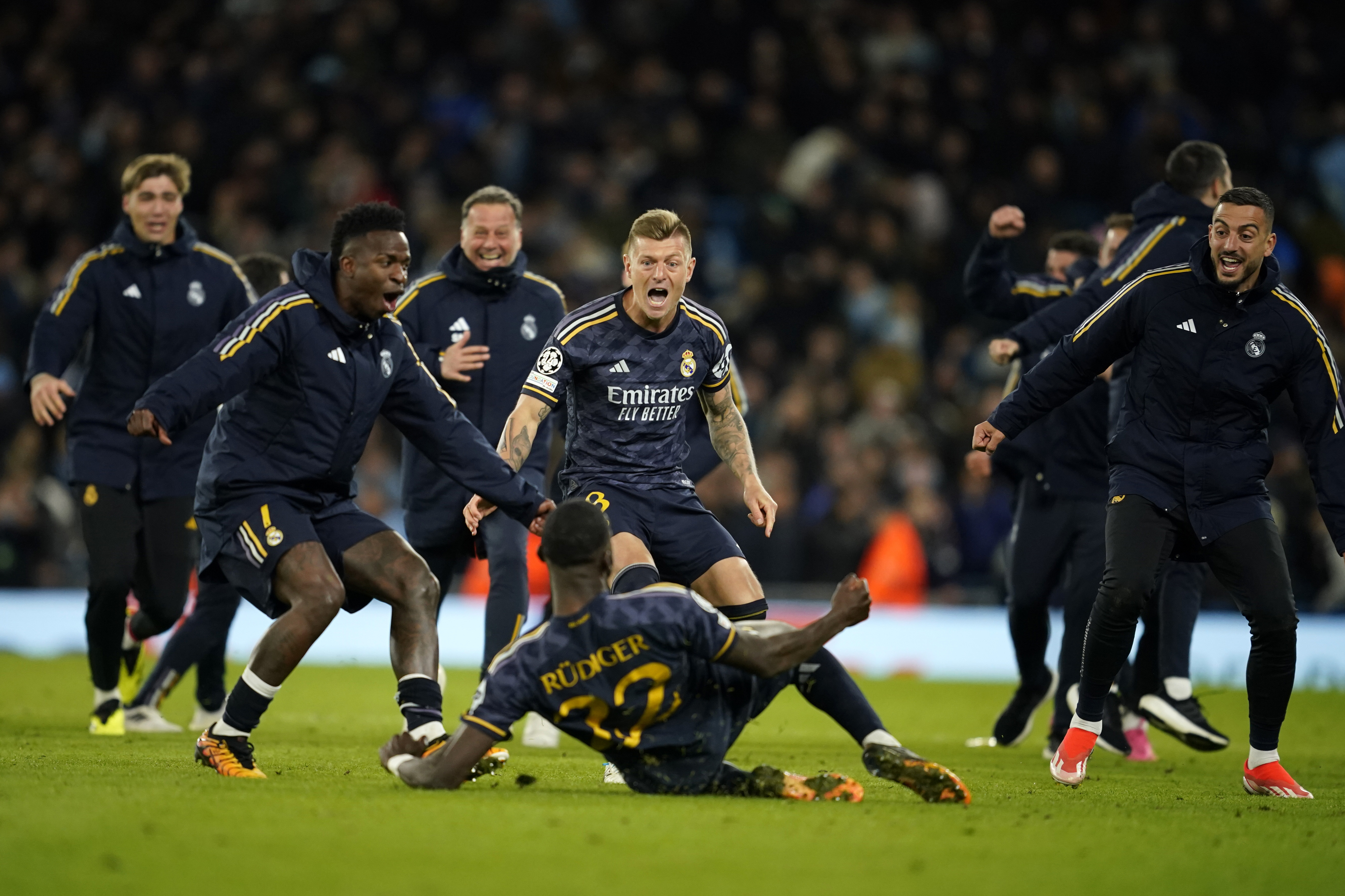 Real Madrid players celebrate after wining the Champions League quarterfinal second leg soccer match between Manchester City and Real Madrid at the Etihad Stadium in Manchester, England, Wednesday, April 17, 2024. (AP Photo/Dave Thompson)