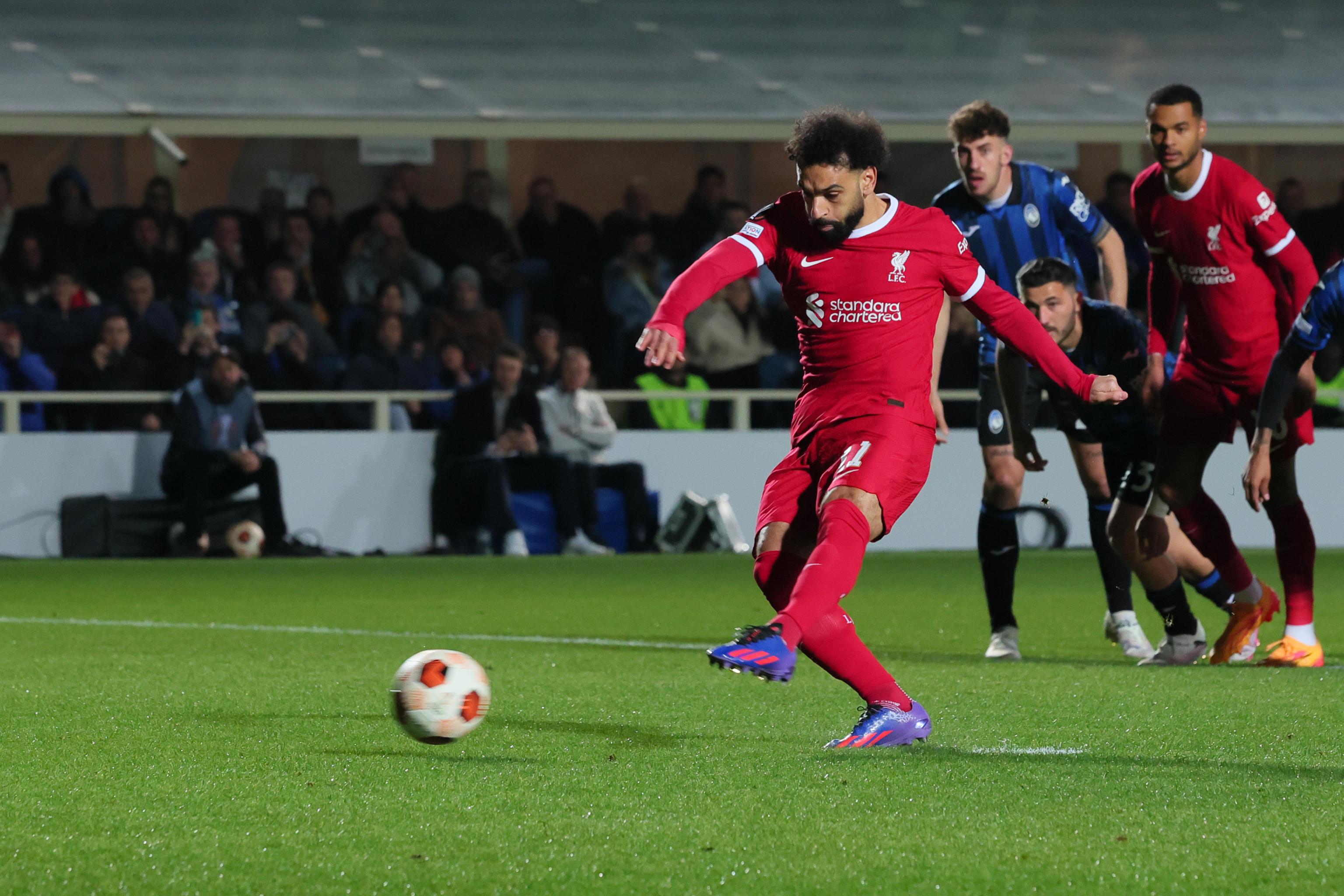 epa11287236 Liverpool's Mohamed Salah scores the goal 0-1 by penalty during the UEFA Europa League quarterfinal 2nd leg soccer match between Atalanta BC and Liverpool FC at the Bergamo Stadium in Bergamo, Italy, 18 April 2024.  EPA-EFE/MICHELE MARAVIGLIA