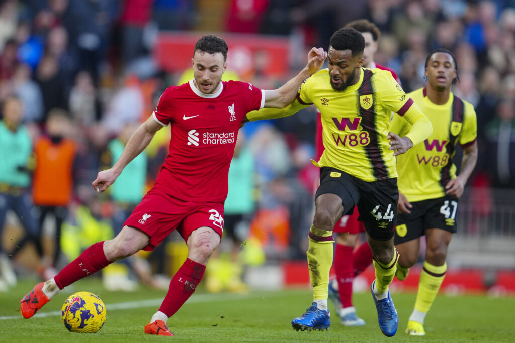 Liverpool's Diogo Jota, left, duels for the ball with Burnley's Hannes Delcroix during the English Premier League soccer match between Liverpool and Burnley, at Anfield stadium in Liverpool, England, Saturday, Feb. 10, 2024. (AP Photo/Jon Super)